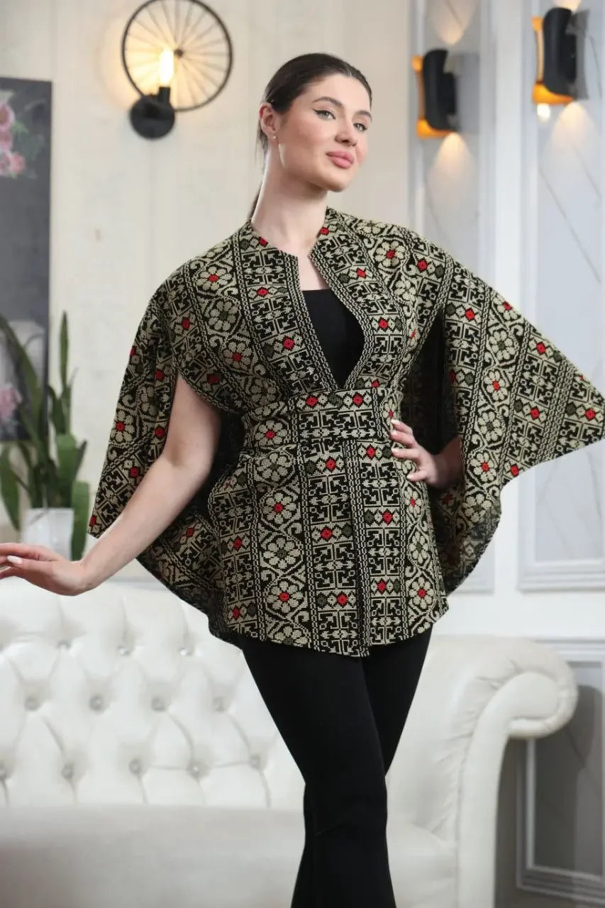 Palestinian embroidered cape by Palestinian Elegance worn as a casual stylish garment with intricate patterns