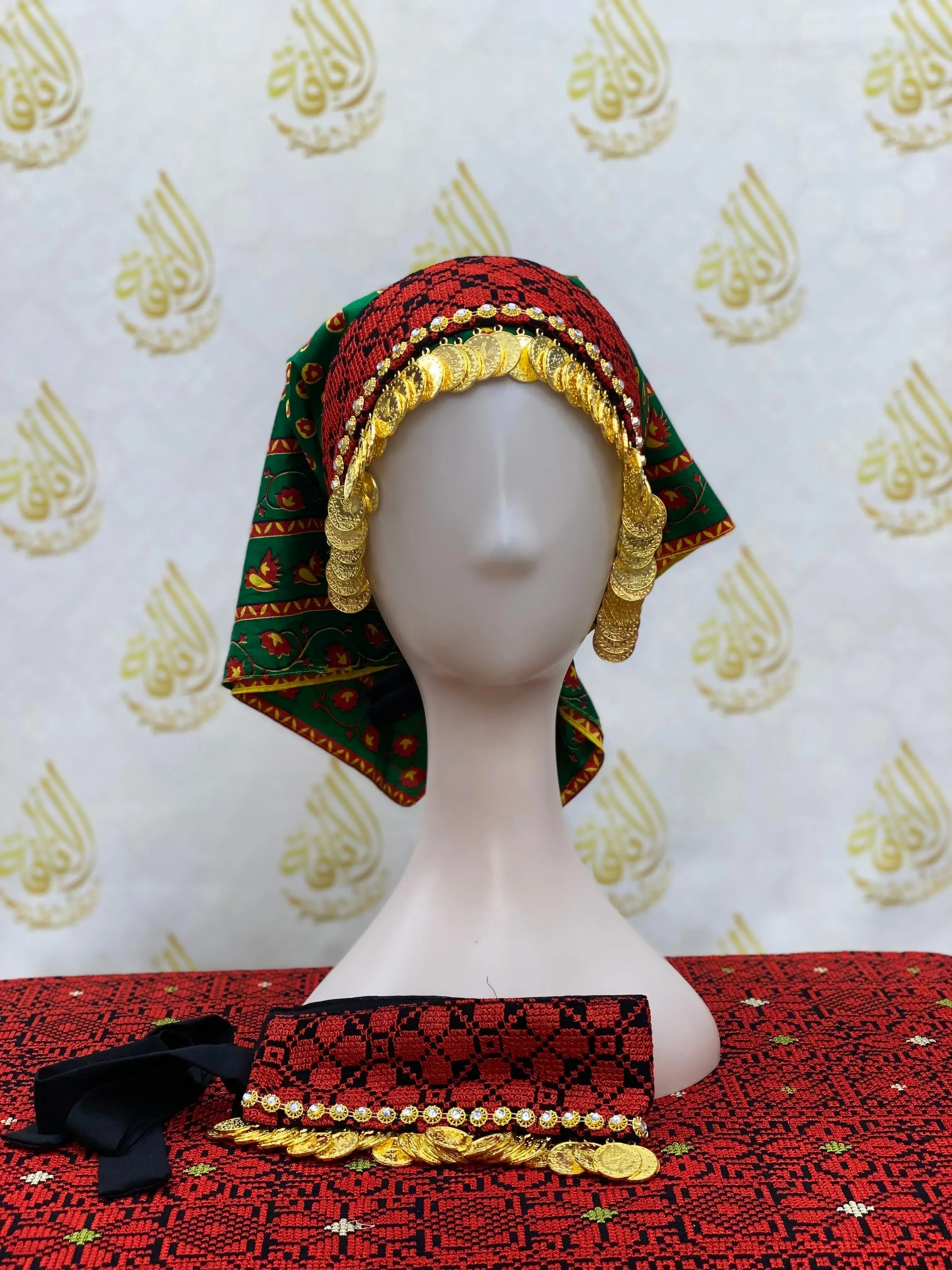 Tatreez head scarf with beads in red and green colors displayed on a mannequin head
