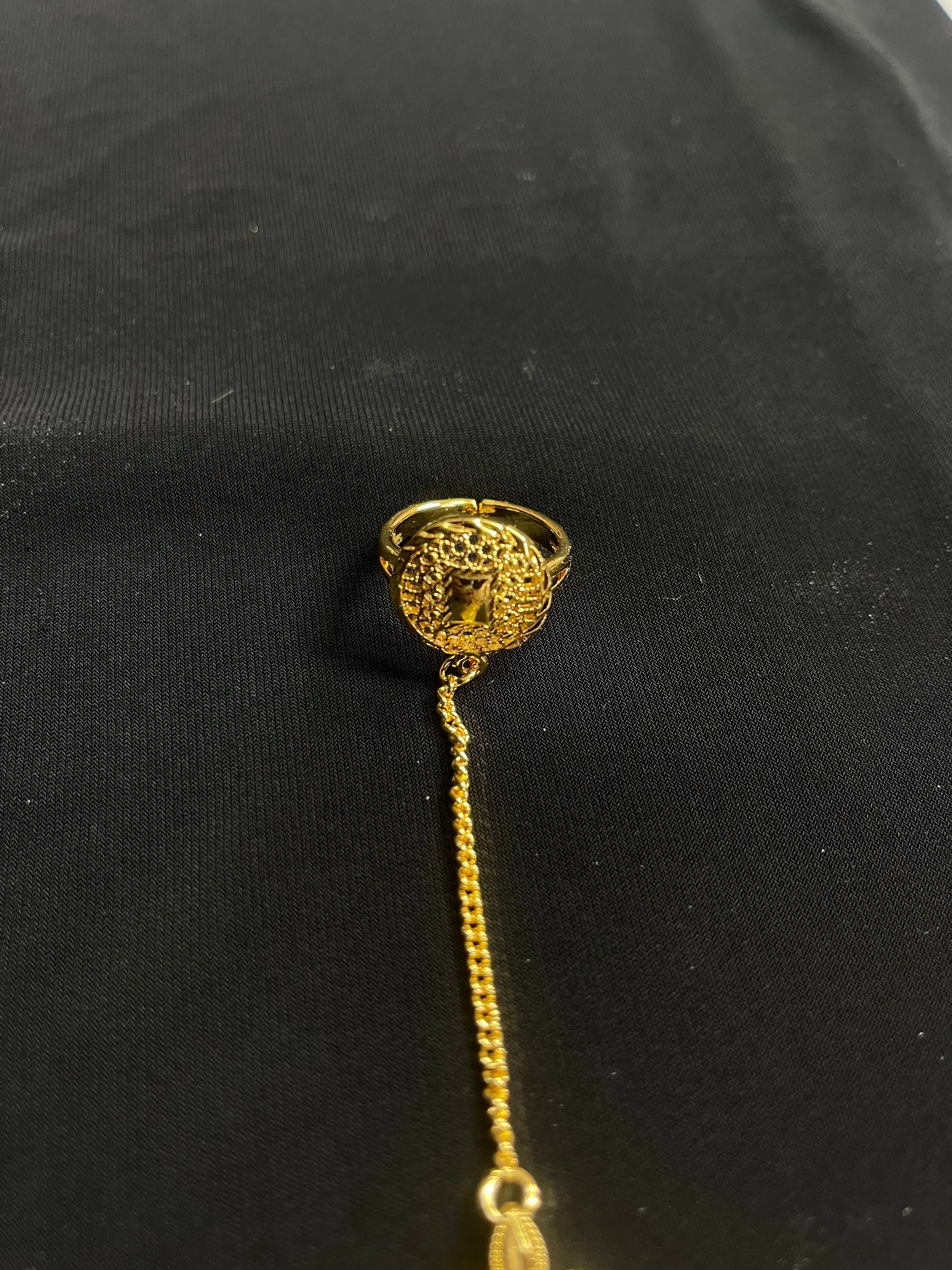 Imitated Gold Bracelet with Ring Design featuring intricate chain and detailed ring from Palestinian Elegance