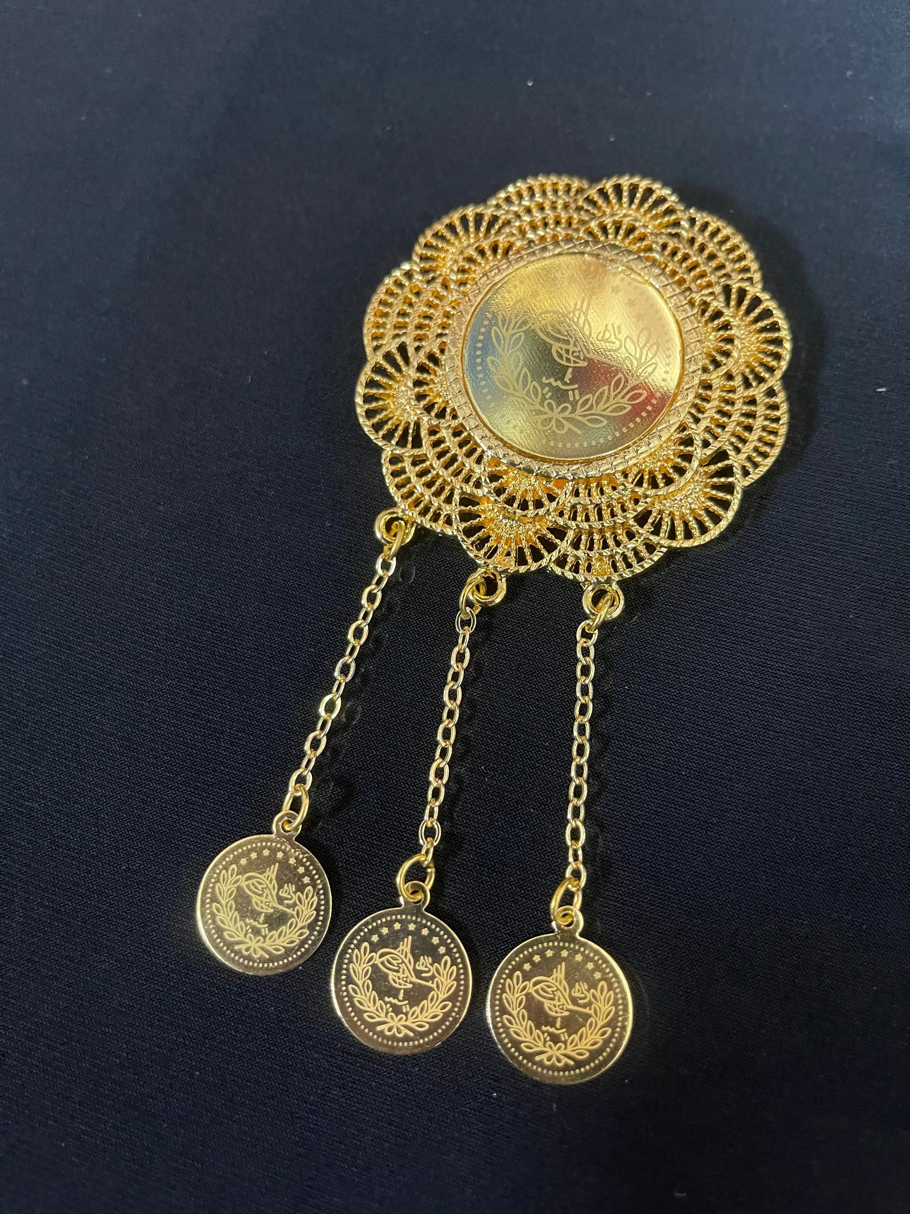 Palestinian Elegance imitated gold coin dangle decorative pin with intricate filigree design and three dangling coin charms
