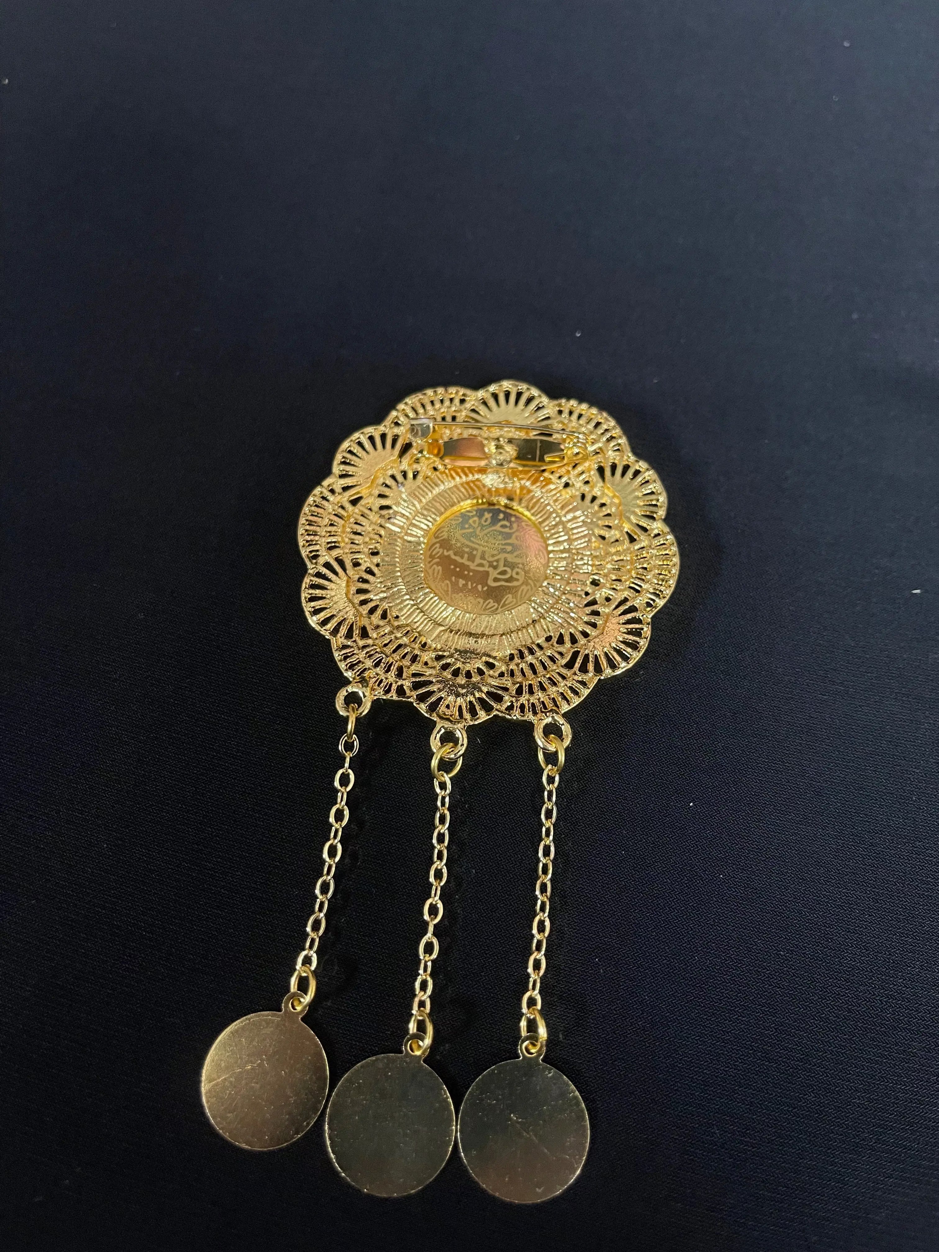 Palestinian Elegance imitated gold coin dangle decorative pin with intricate filigree design and three hanging coins