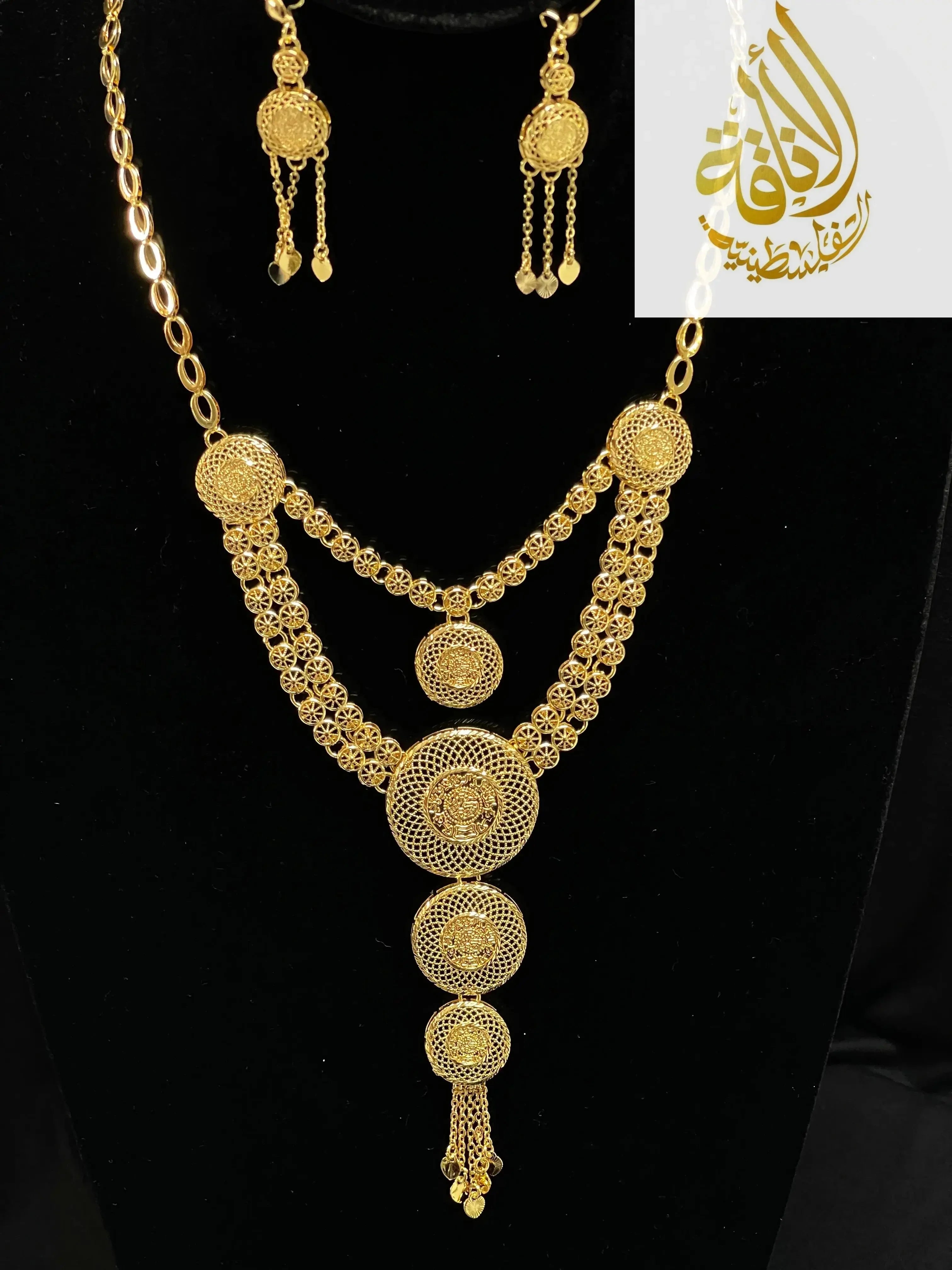 Palestinian Elegance gold layered necklace set with intricate circular filigree design and matching earrings