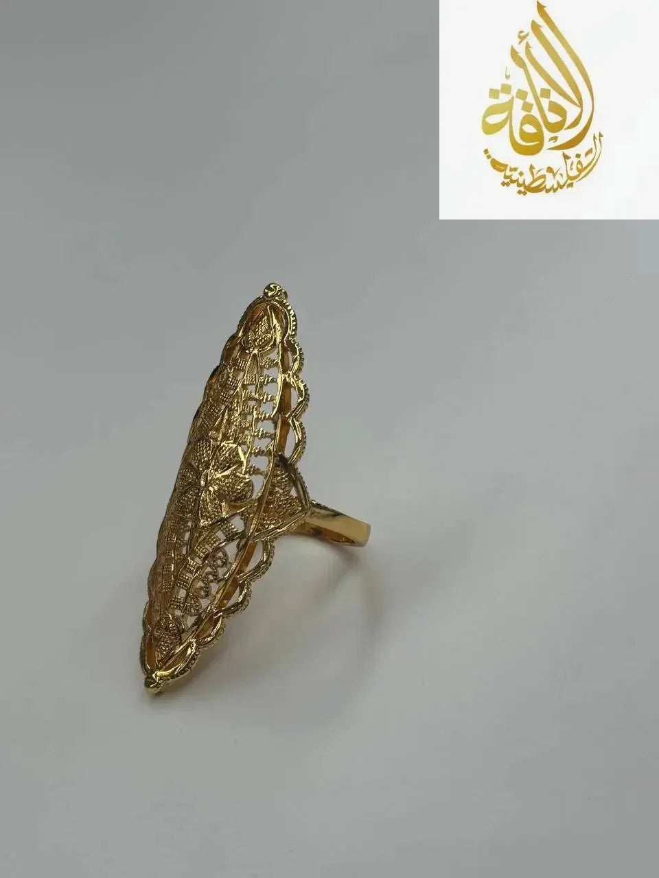 Imitated gold ring from Palestinian Elegance with a unique flower ring design and intricate filigree detailing