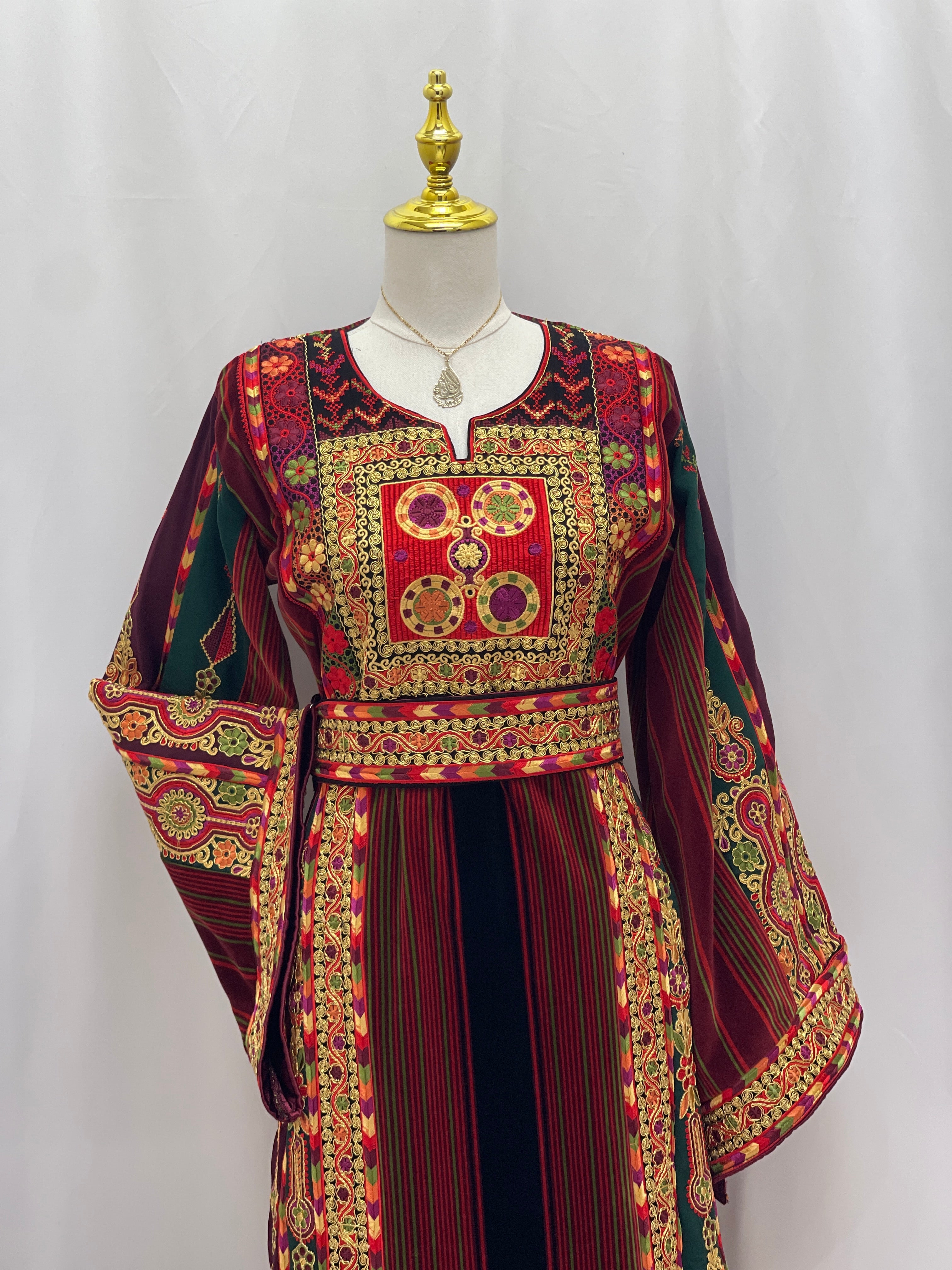 Palestinian Velvet Malaka Embroidered Thobe by Palestinian Elegance with intricate red and gold embroidery