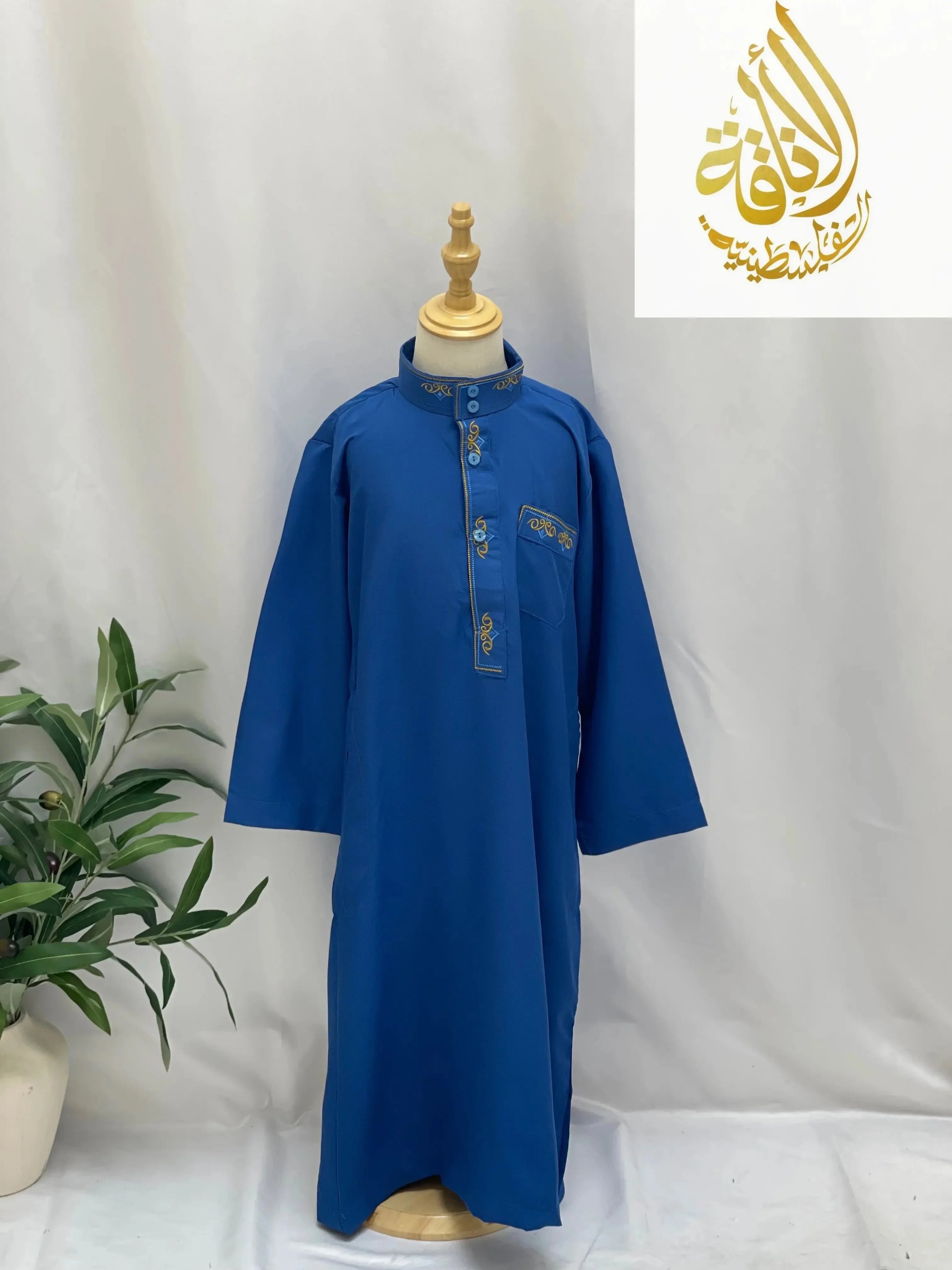 Blue kids embroidered thobe with gold detailing on collar and chest pocket by Palestinian Elegance