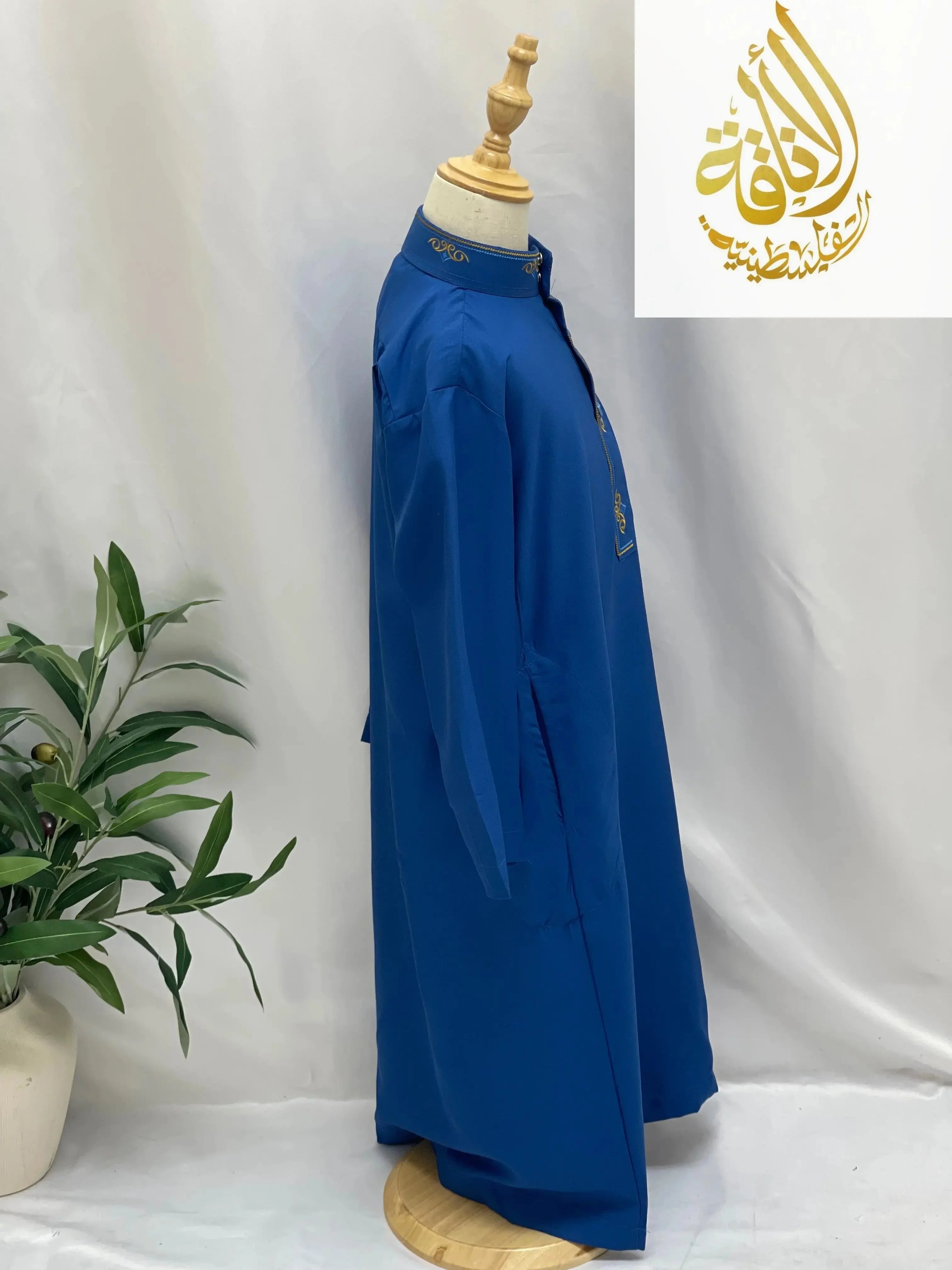 Palestinian Elegance kids embroidered thobe in royal blue with gold detailing on collar and chest