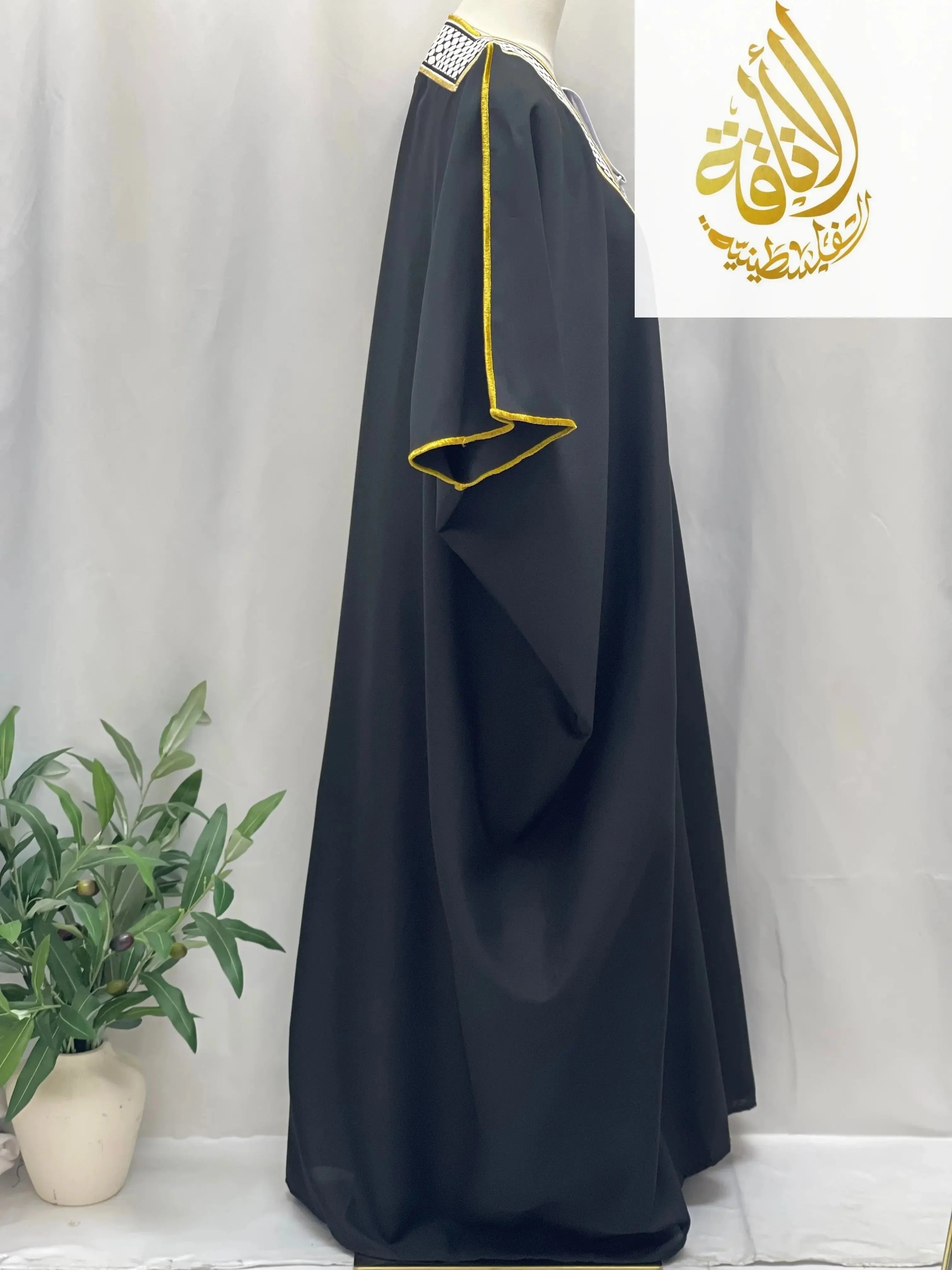 Palestinian Elegance men thobe with gold trim displayed on mannequin keffiyeh bisht for sale