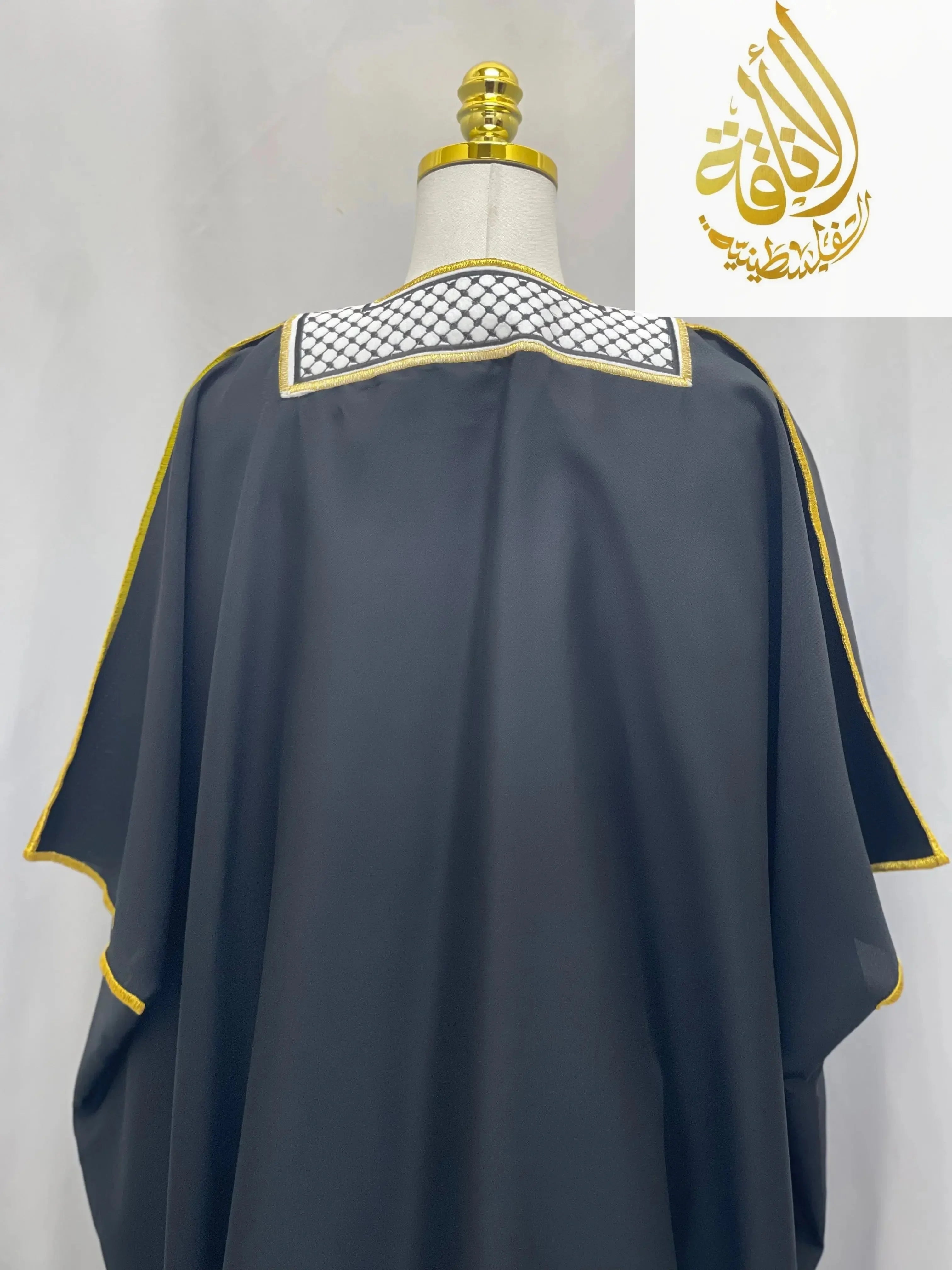 Men's Keffiyeh bisht for sale by Palestinian Elegance with black fabric and gold trim detailing