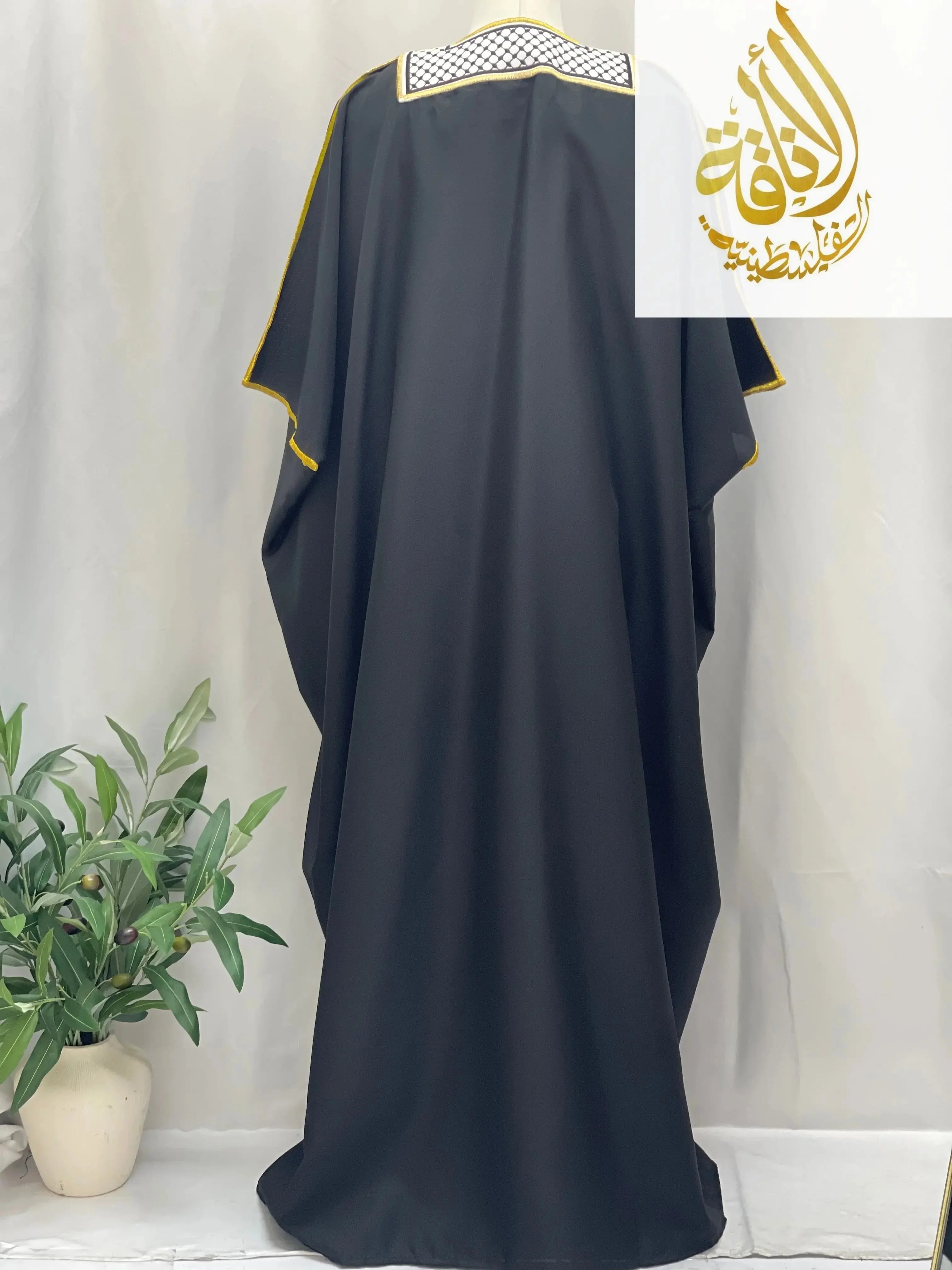 Black men thobe with keffiyeh bisht for sale featuring gold trim by Palestinian Elegance