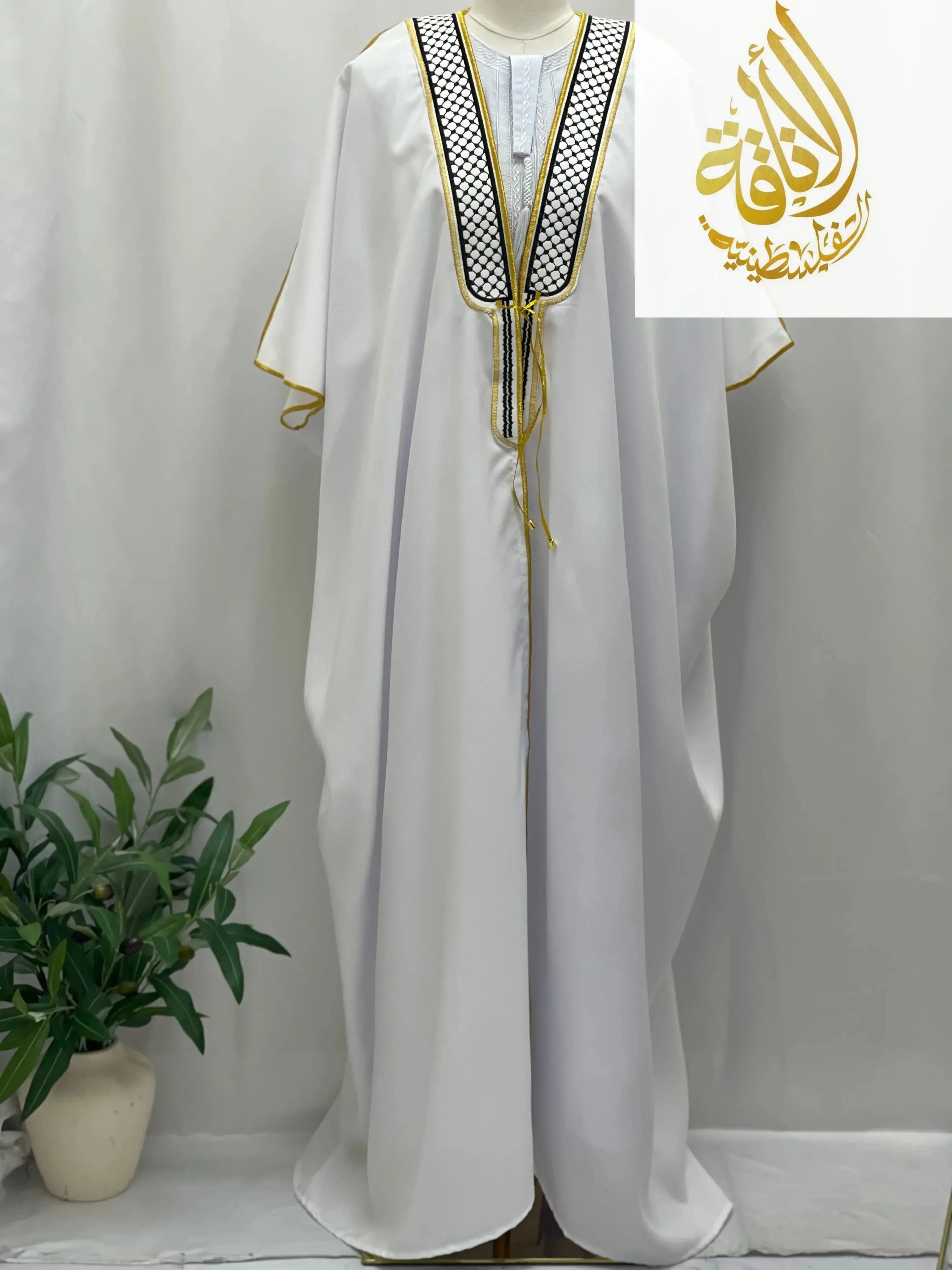 Palestinian Elegance men thobe with black and white keffiyeh bisht for sale featuring gold trim accents