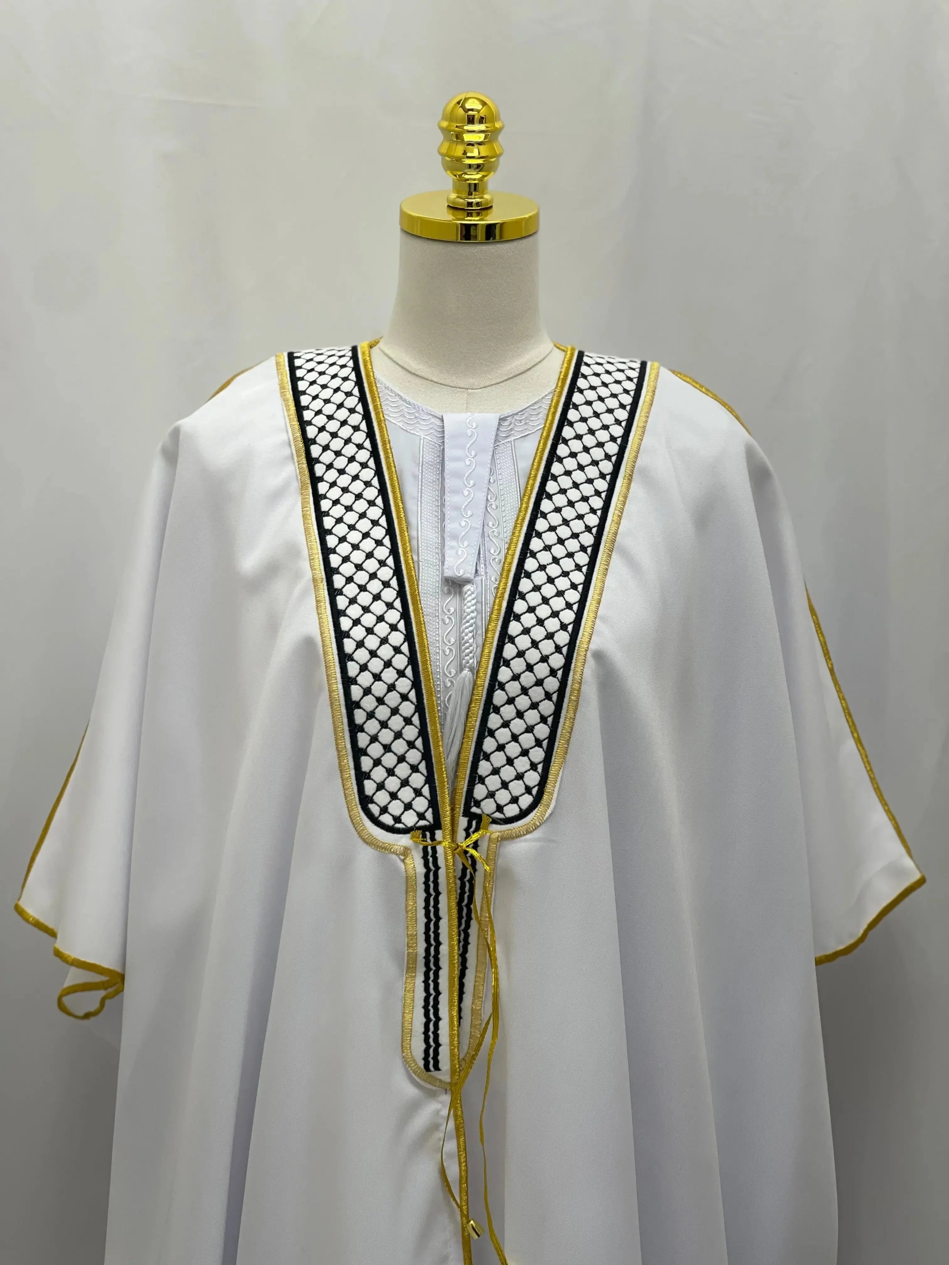 Palestinian Elegance white men thobe with black and gold keffiyeh bisht for sale on mannequin