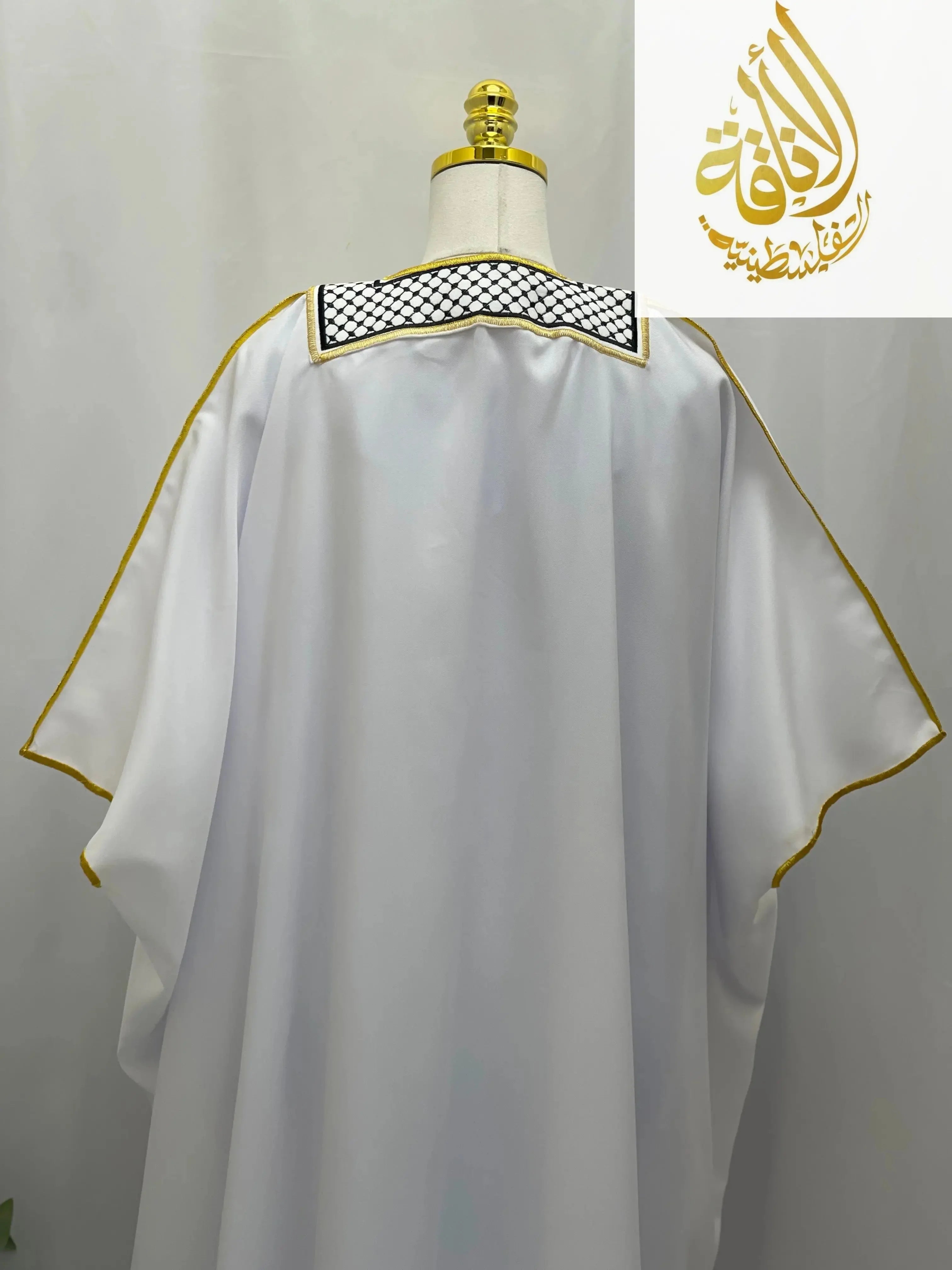 Palestinian Elegance men thobe with keffiyeh bisht for sale featuring white fabric and gold trim detailing