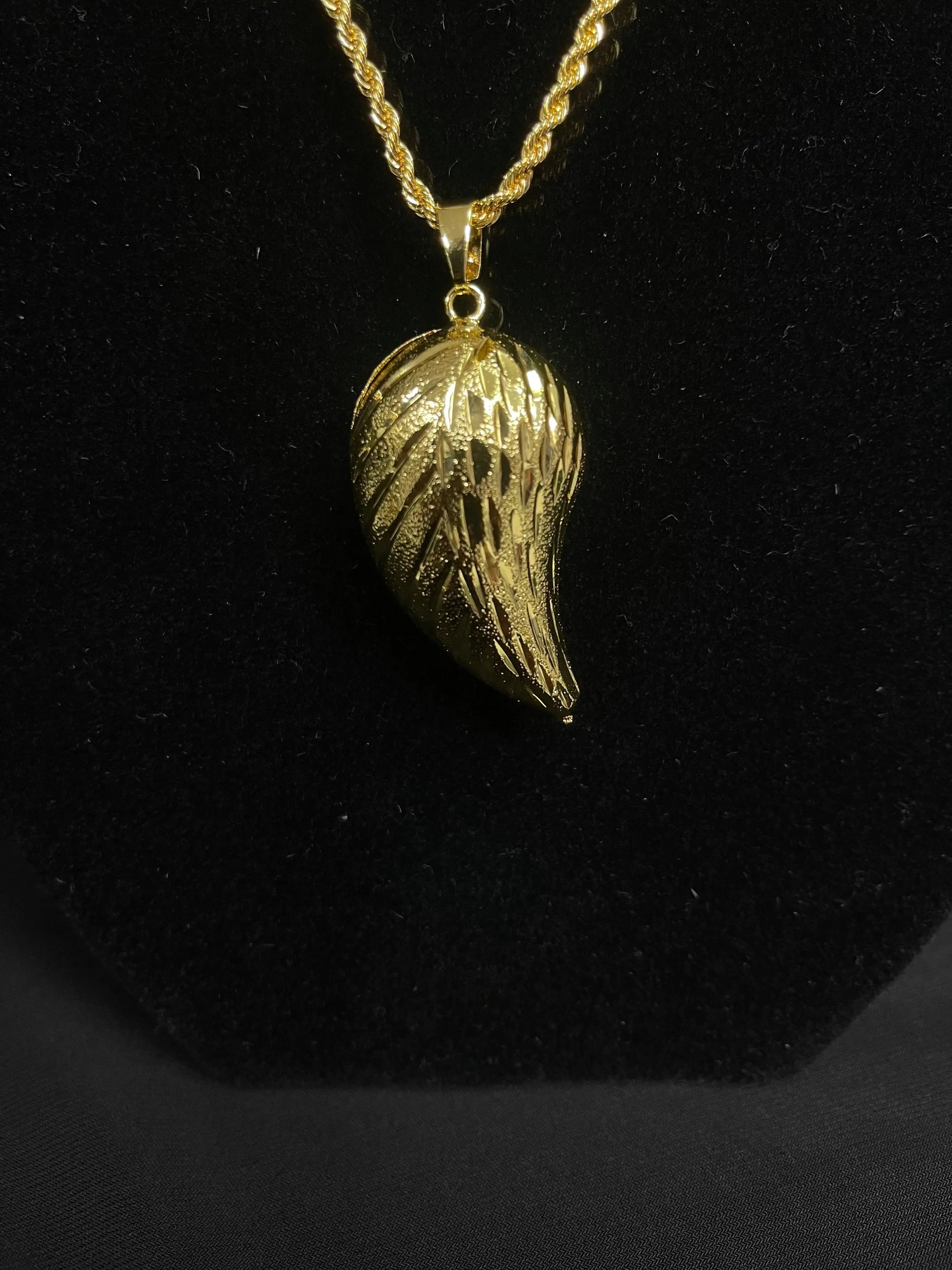 Palestinian Elegance Large Almond Pendant in imitated gold with intricate textured design on gold chain