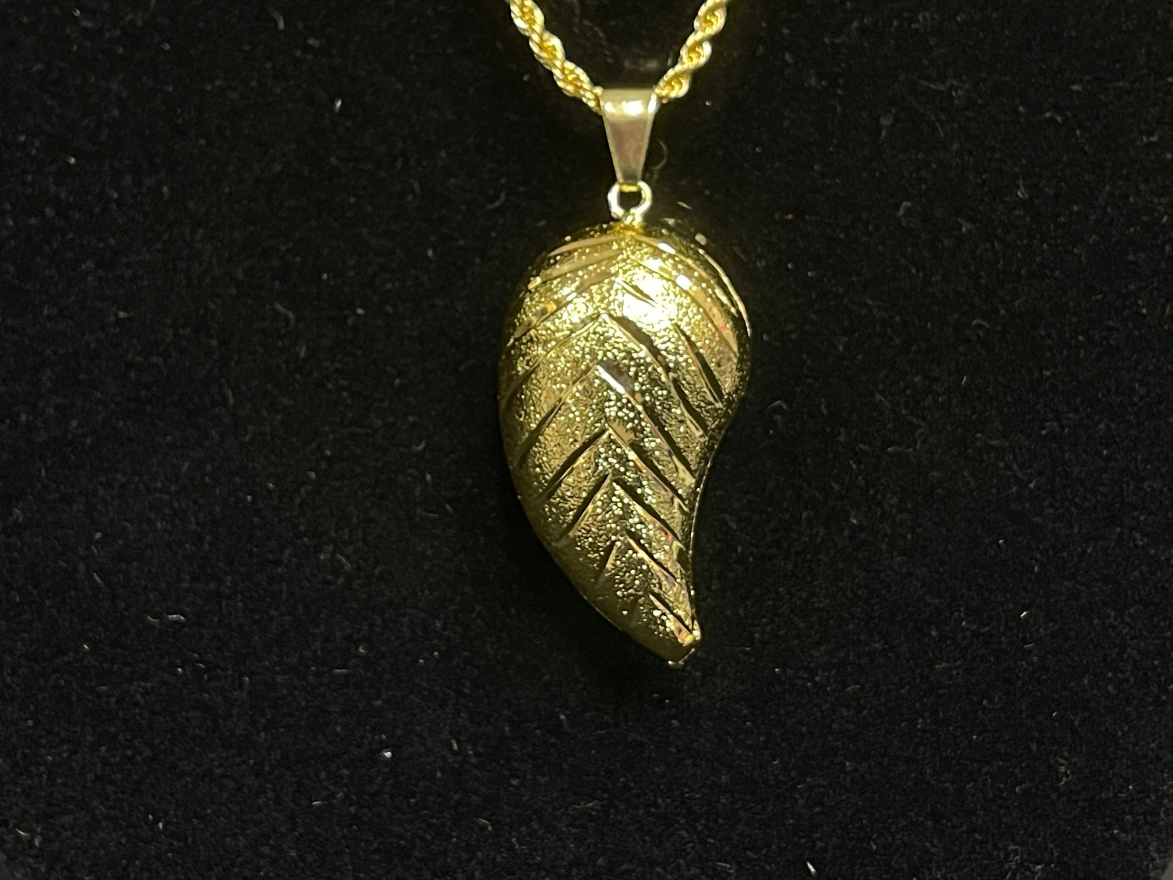 Large Almond Pendant in imitated gold with intricate textured design from Palestinian Elegance