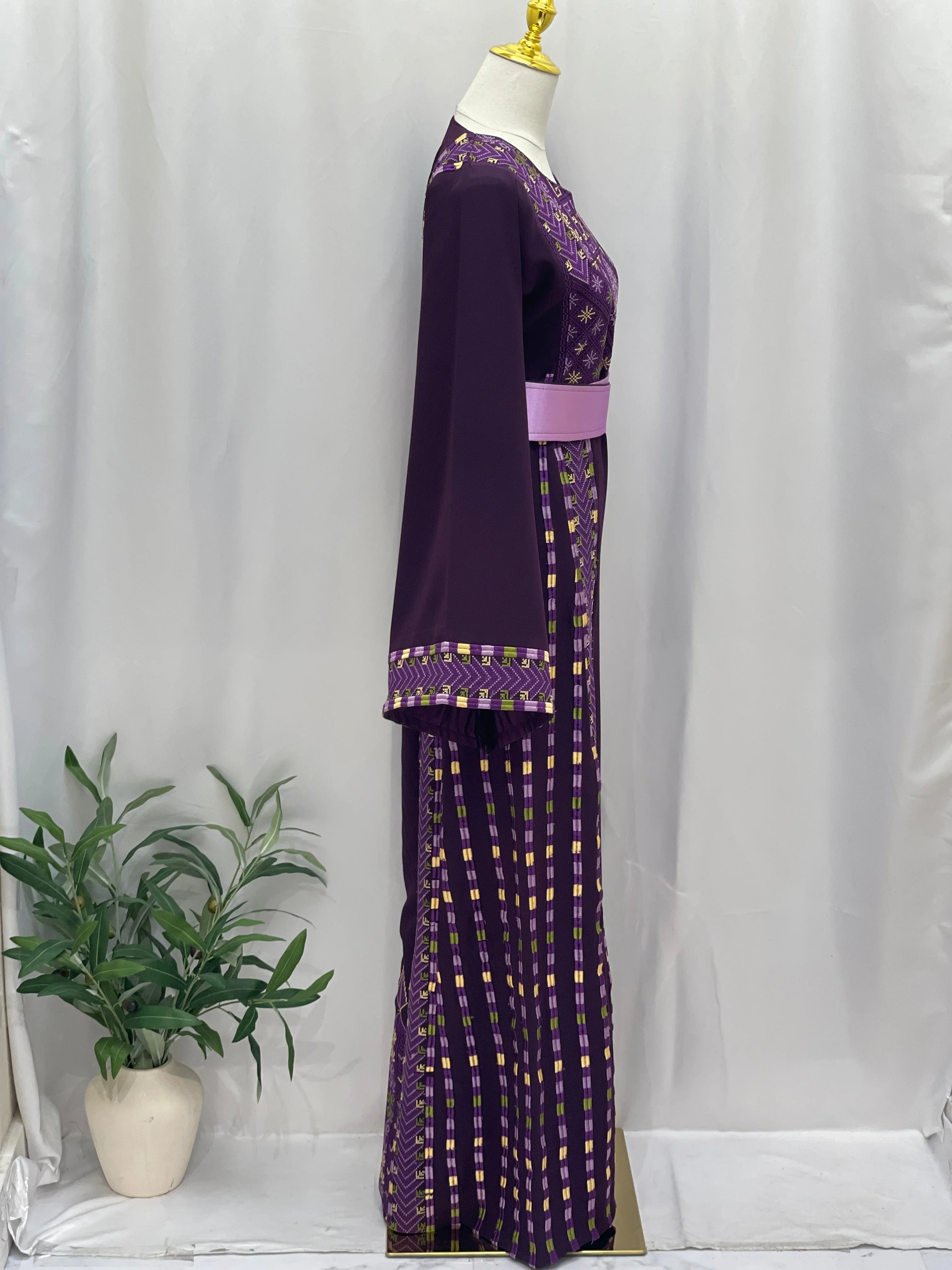 Side view of Lavender Heritage Embroidered Thobe with intricate embroidery and a stylish belt