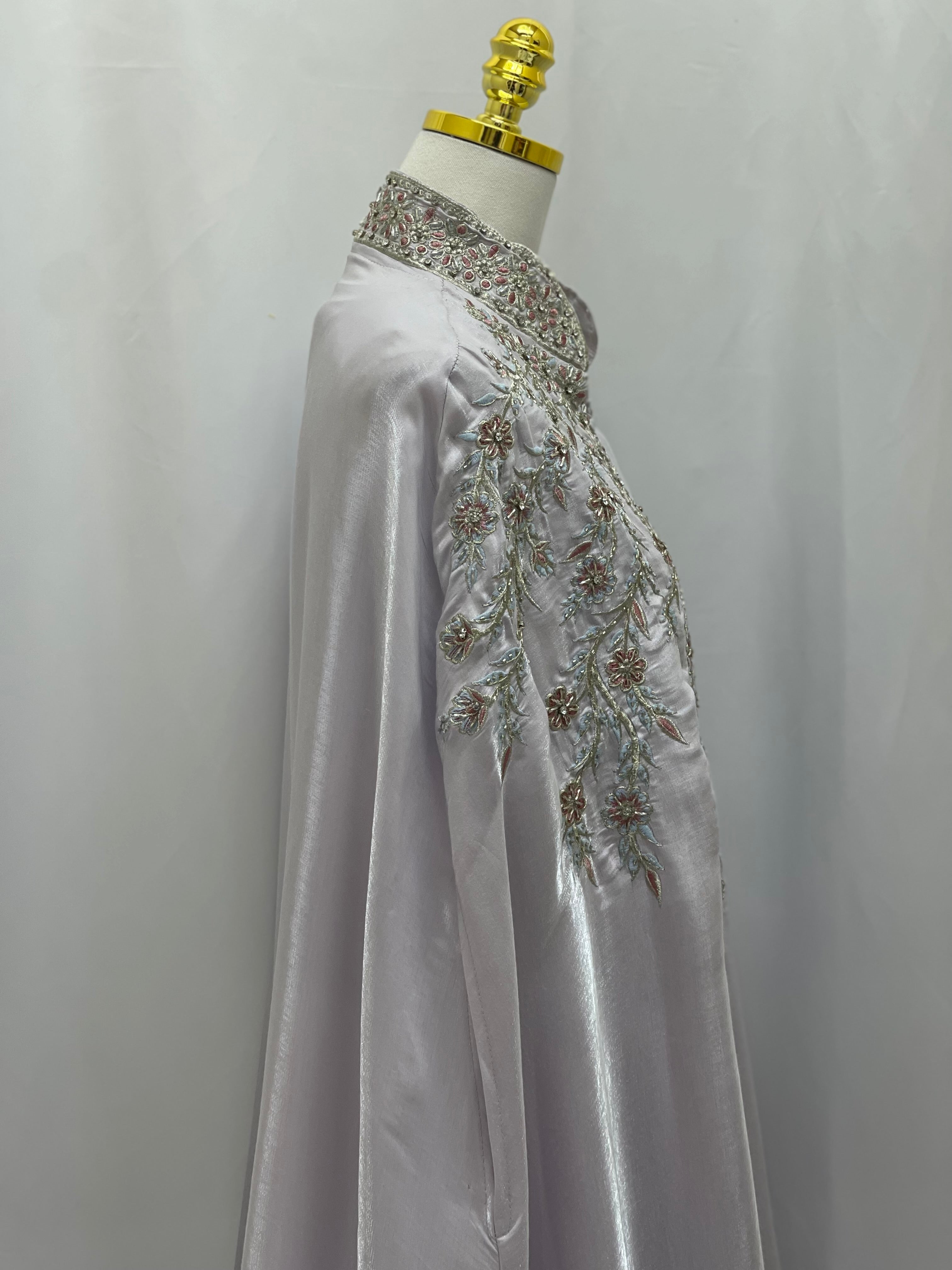 Palestinian Elegance Layla Fancy kaftan in silver with intricate floral embroidery on the chest and collar