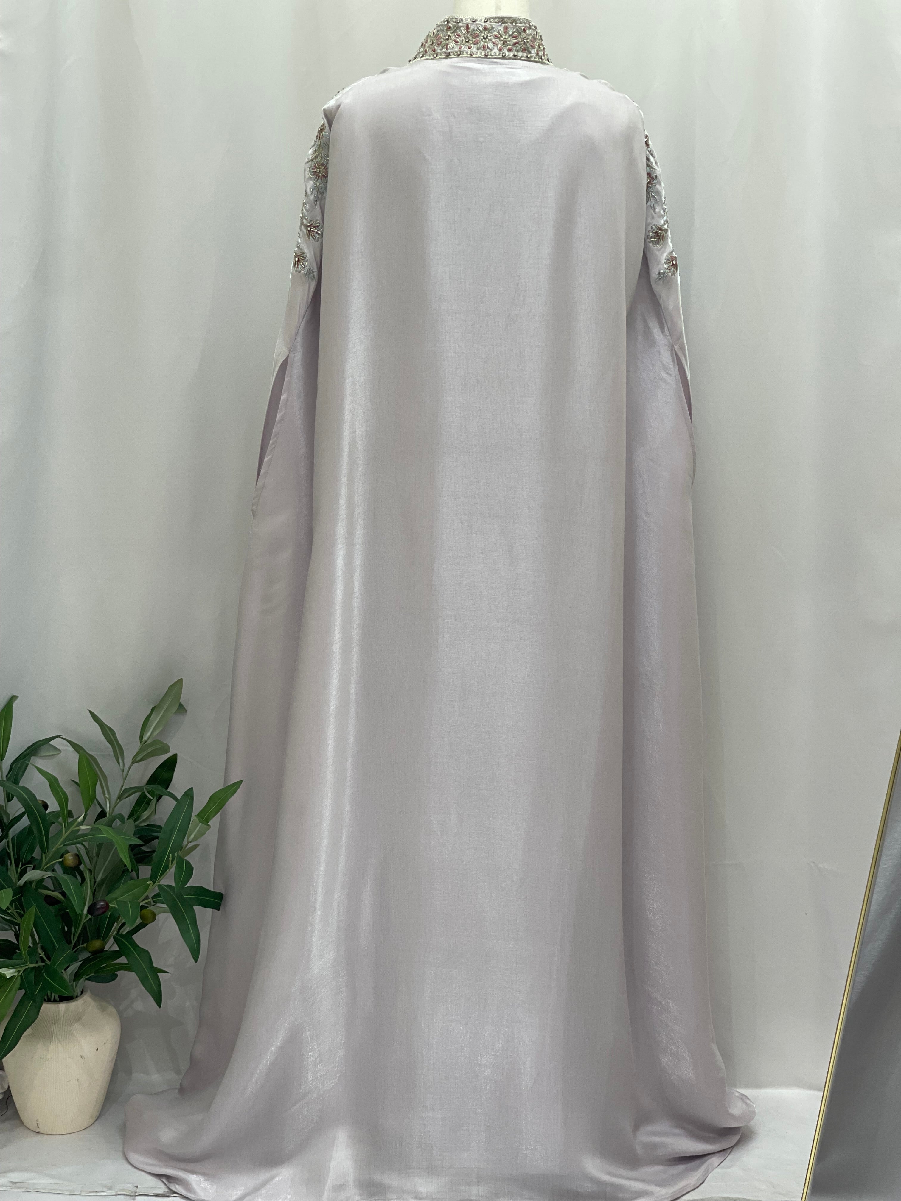Back view of Layla Fancy kaftan by Palestinian Elegance in light lavender with intricate shoulder embroidery
