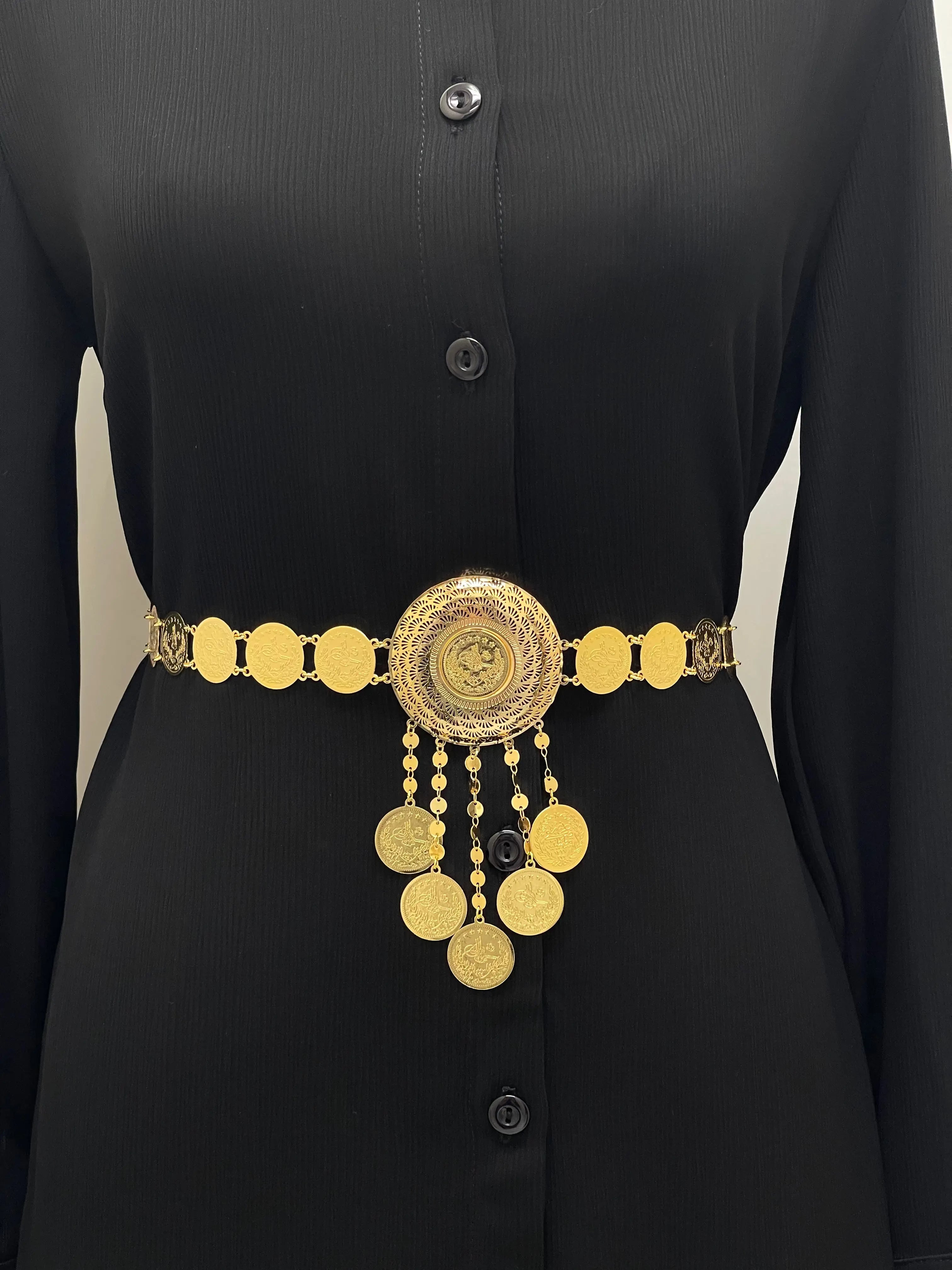 Lerat Gold Belt Imitated Gold by Palestinian Elegance worn over black dress featuring round central medallion with hanging coin charms