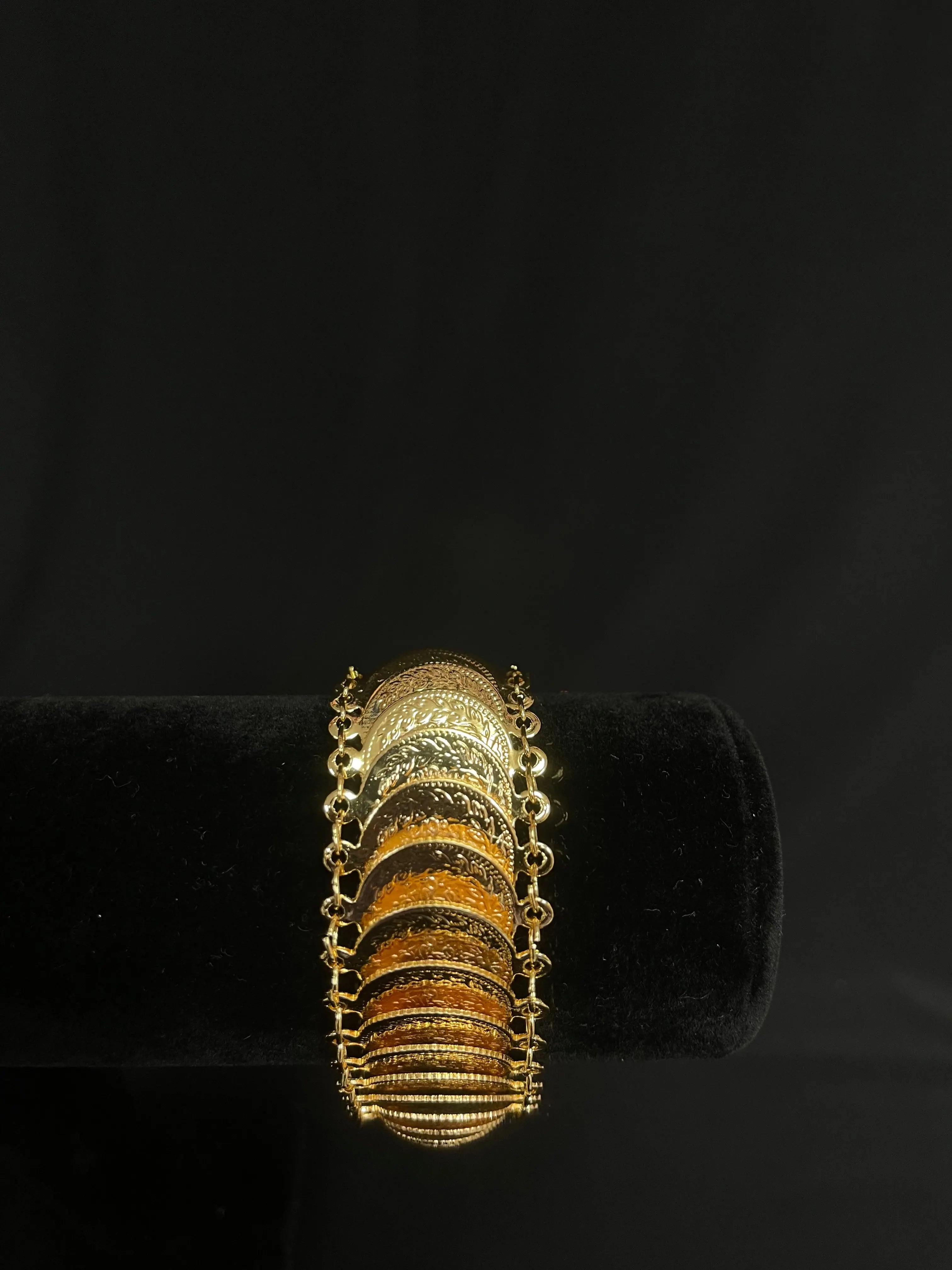 Gold imitated with palestine traditional design bracelet by Palestinian Elegance on black display