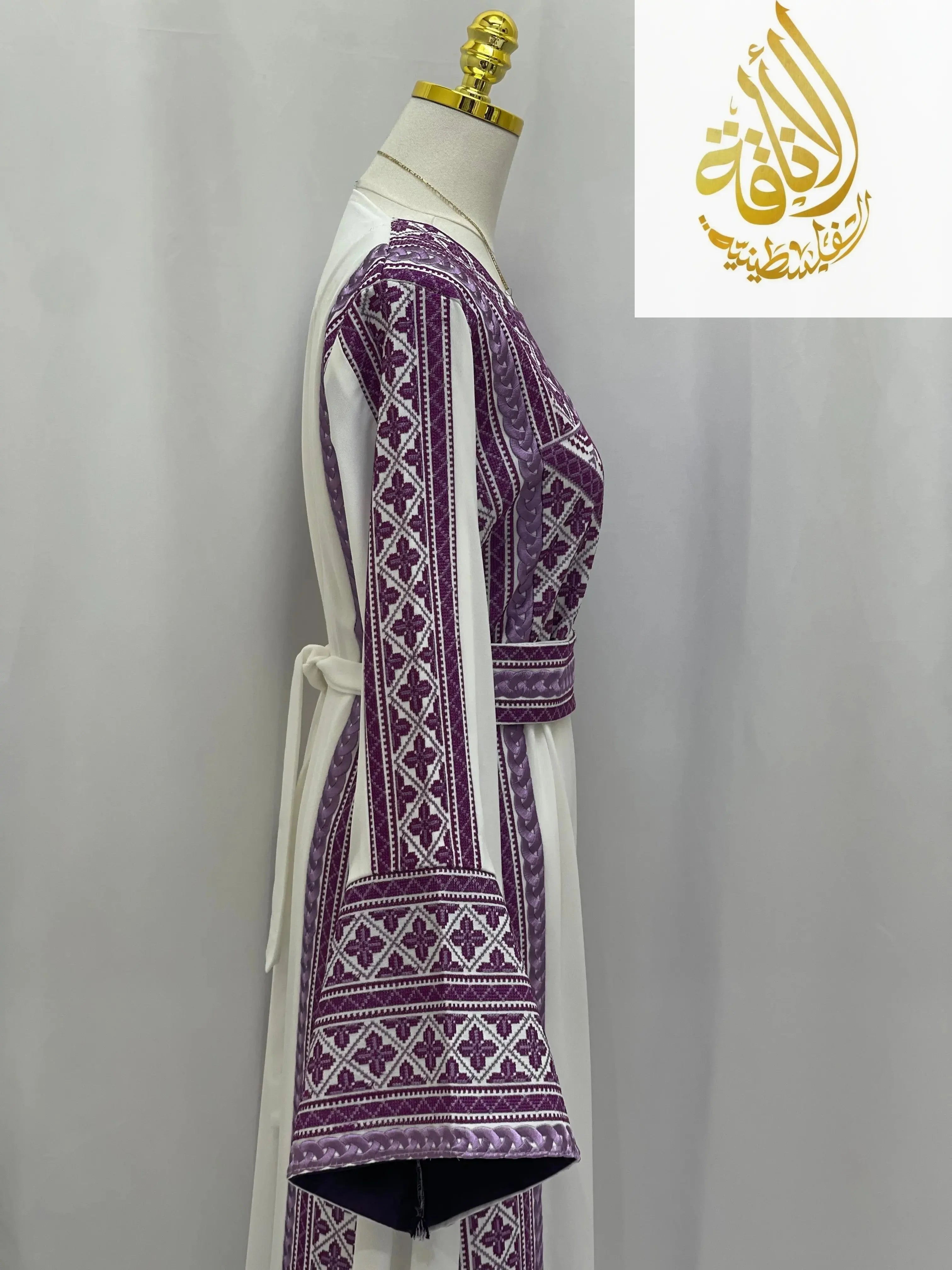 Lilac Embroidered Unique Thoub by Palestinian Elegance with detailed traditional embroidery on white fabric