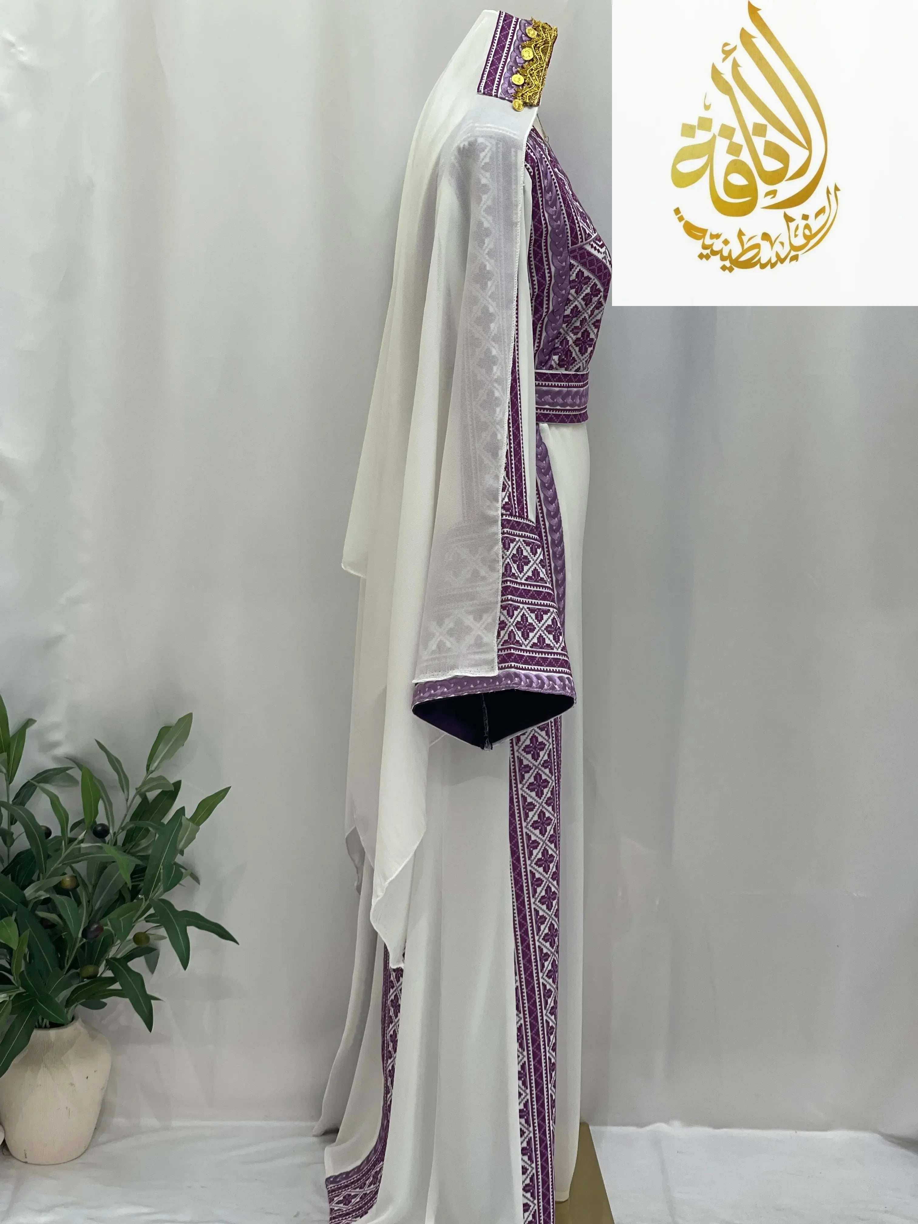 Palestinian Elegance Lilac Embroidered Unique Thoub with detailed lilac embroidery on white fabric