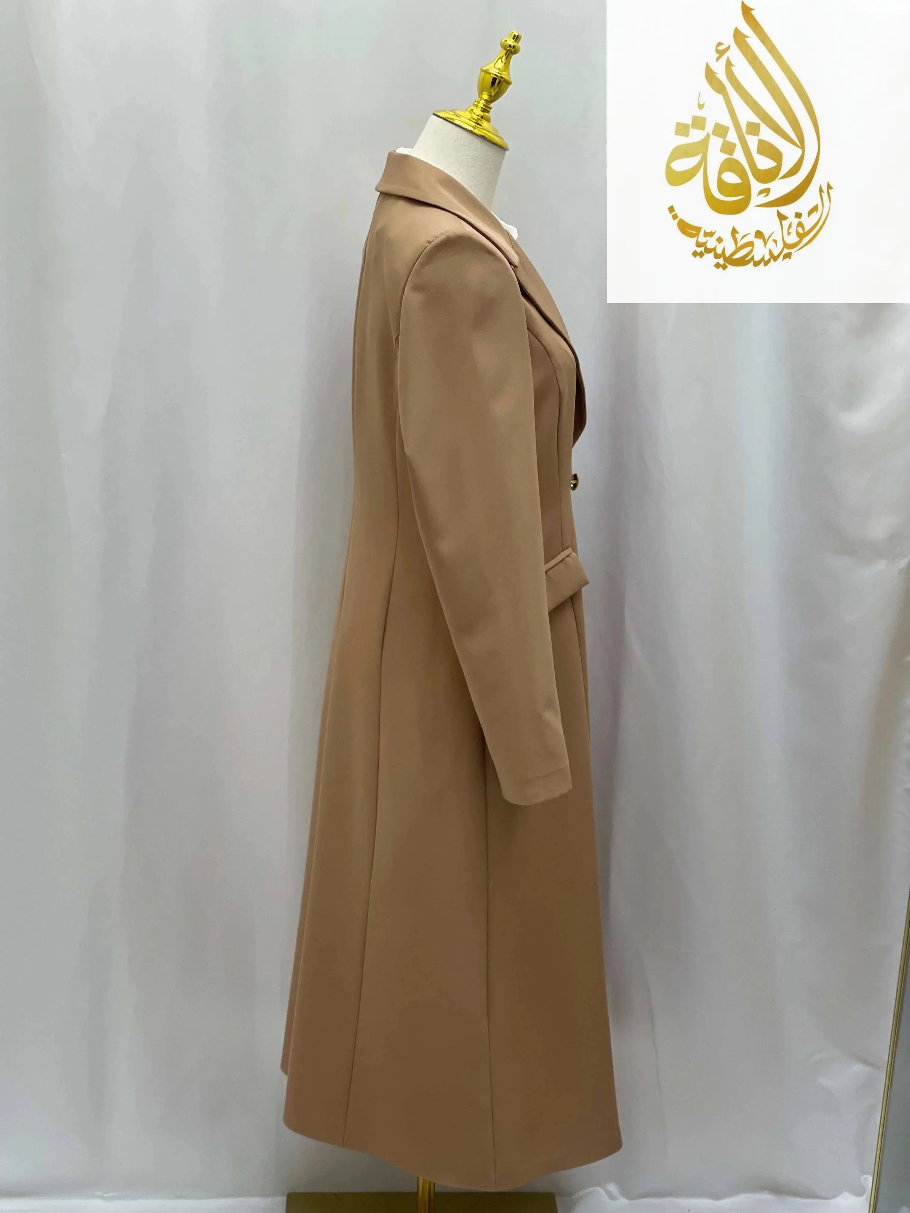 Palestinian Elegance Long Modesty Blazer in beige displayed on mannequin against white background
