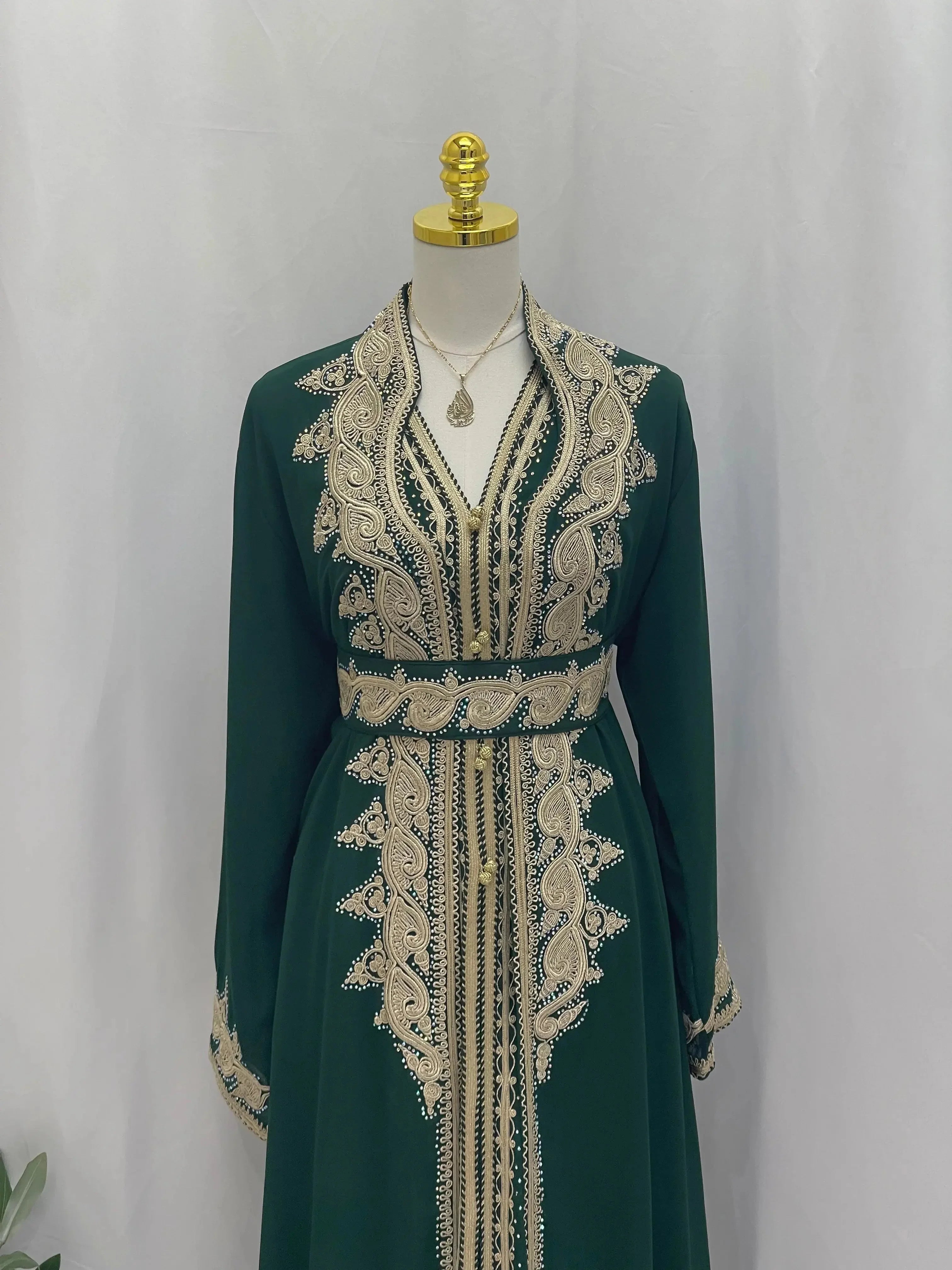 Palestinian Elegance luxurious Alamera kaftan in deep green with intricate beige embroidery and matching belt