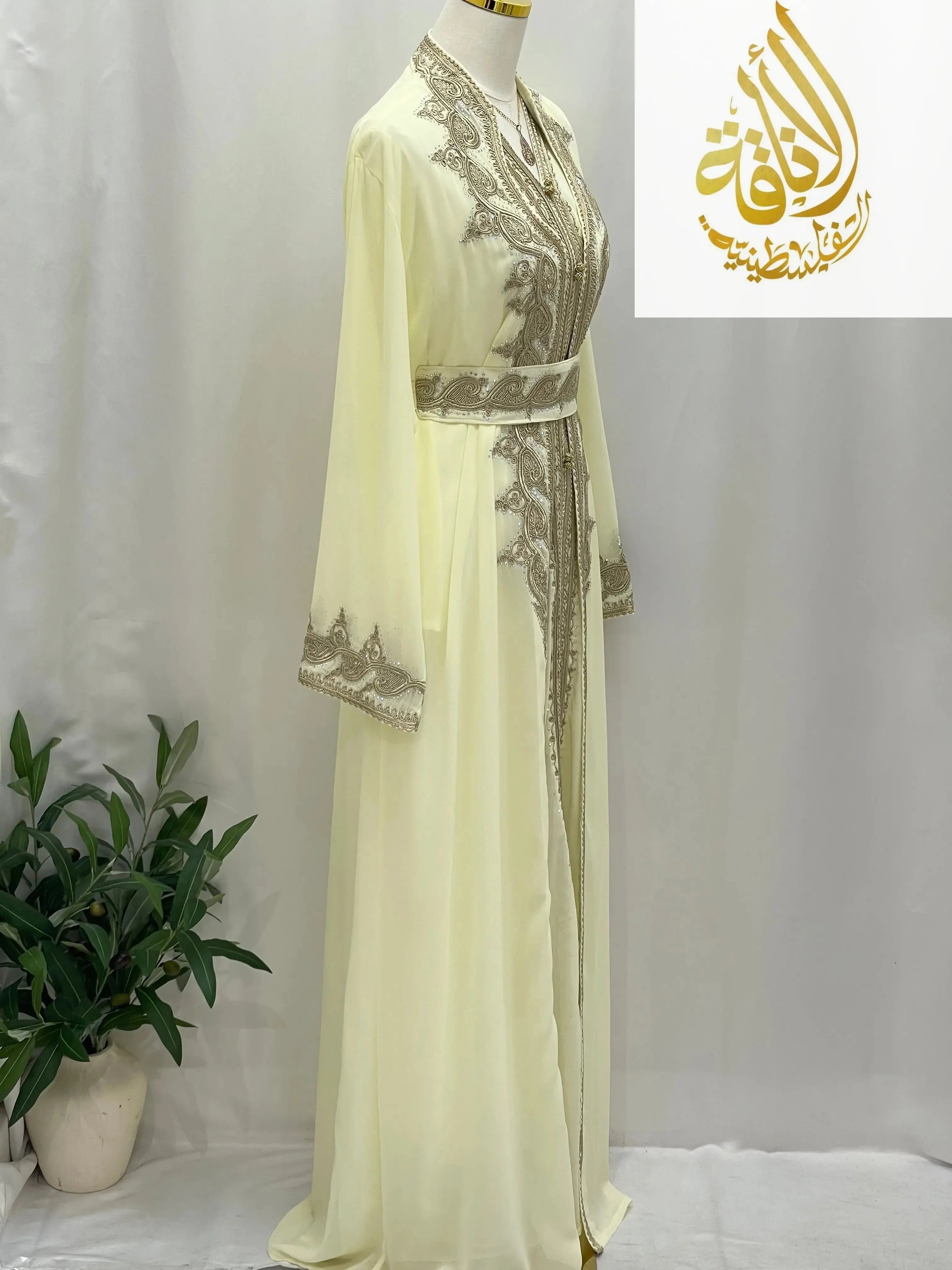 Palestinian Elegance luxurious Alamera kaftan in cream with intricate silver embroidery and long sleeves