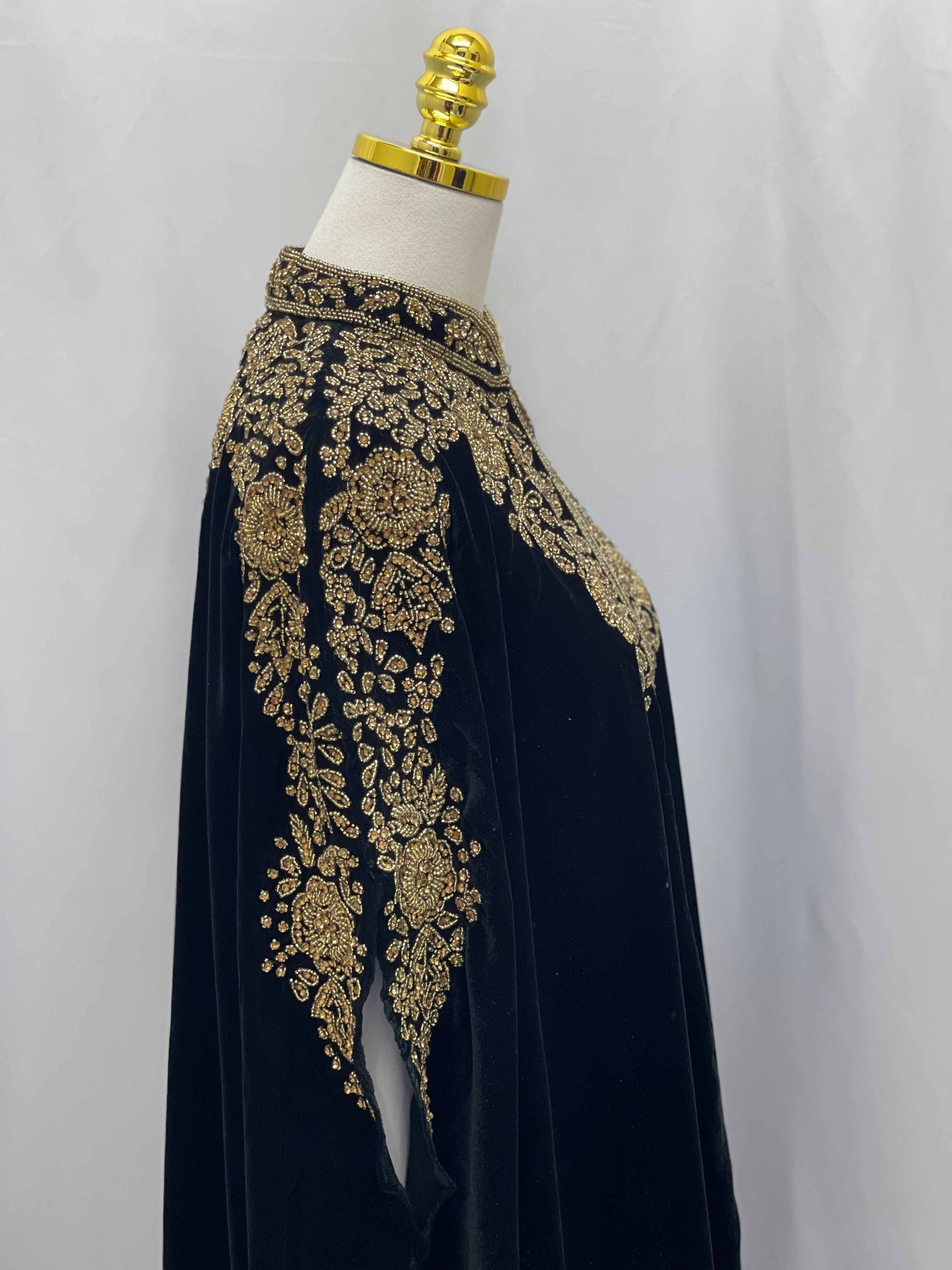 Palestinian Elegance Velvet Embellished Cape cardigan in black with intricate gold embroidery on shoulders and sleeves