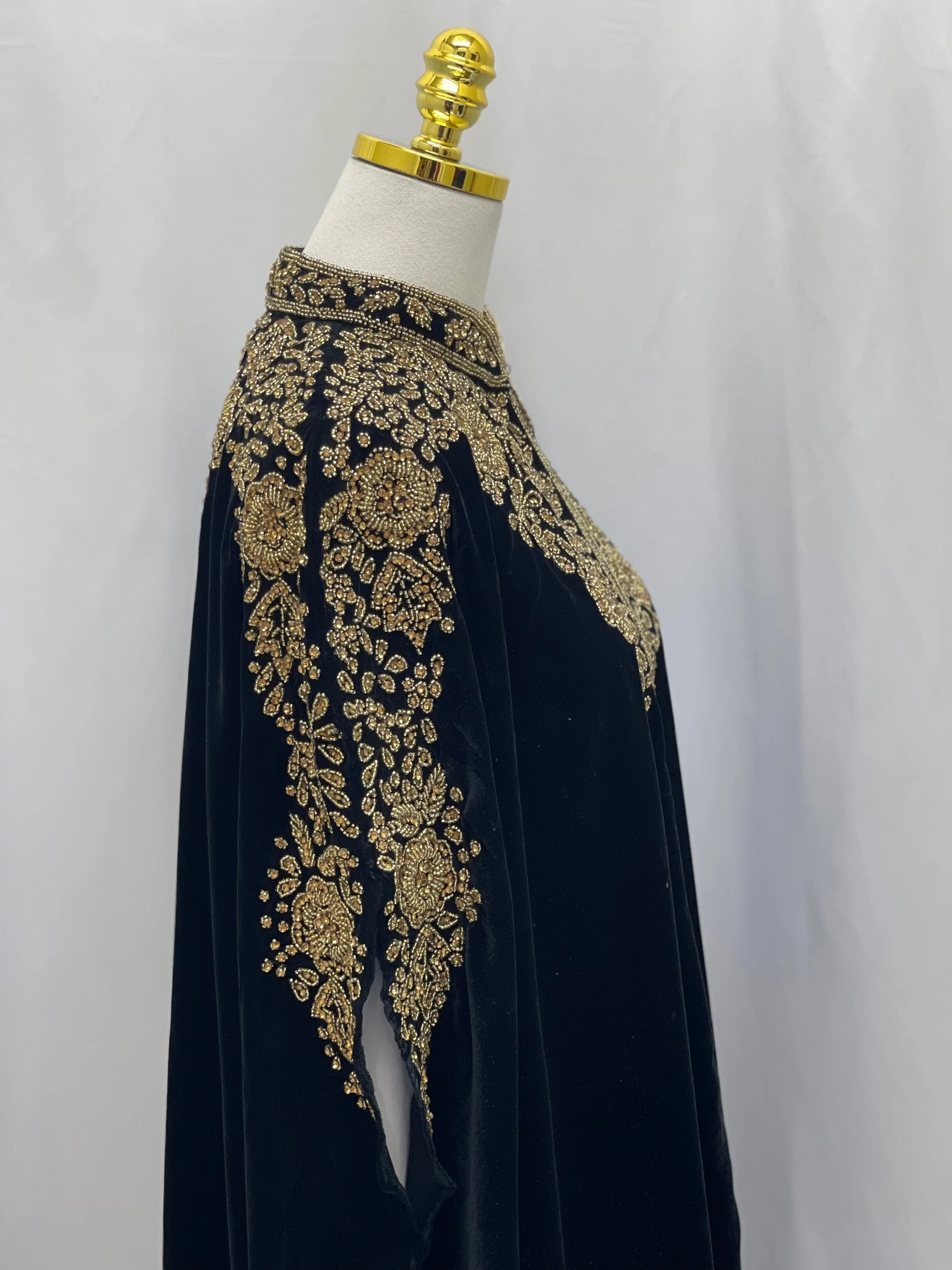 Palestinian Elegance Velvet Embellished Cape cardigan in black with intricate gold embroidery on shoulders and sleeves