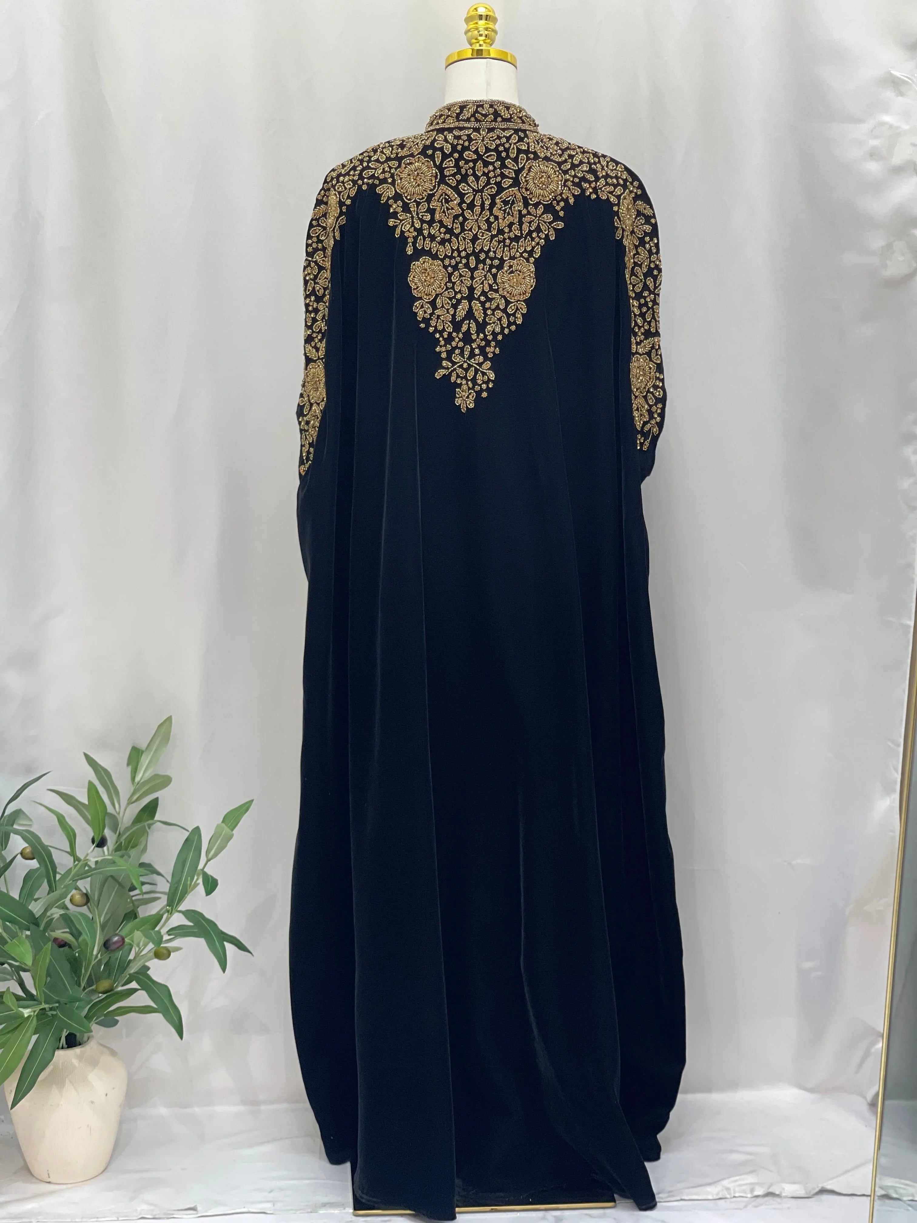 Palestinian Elegance Velvet Embellished Cape black cardigan with intricate gold embroidery on back and shoulders
