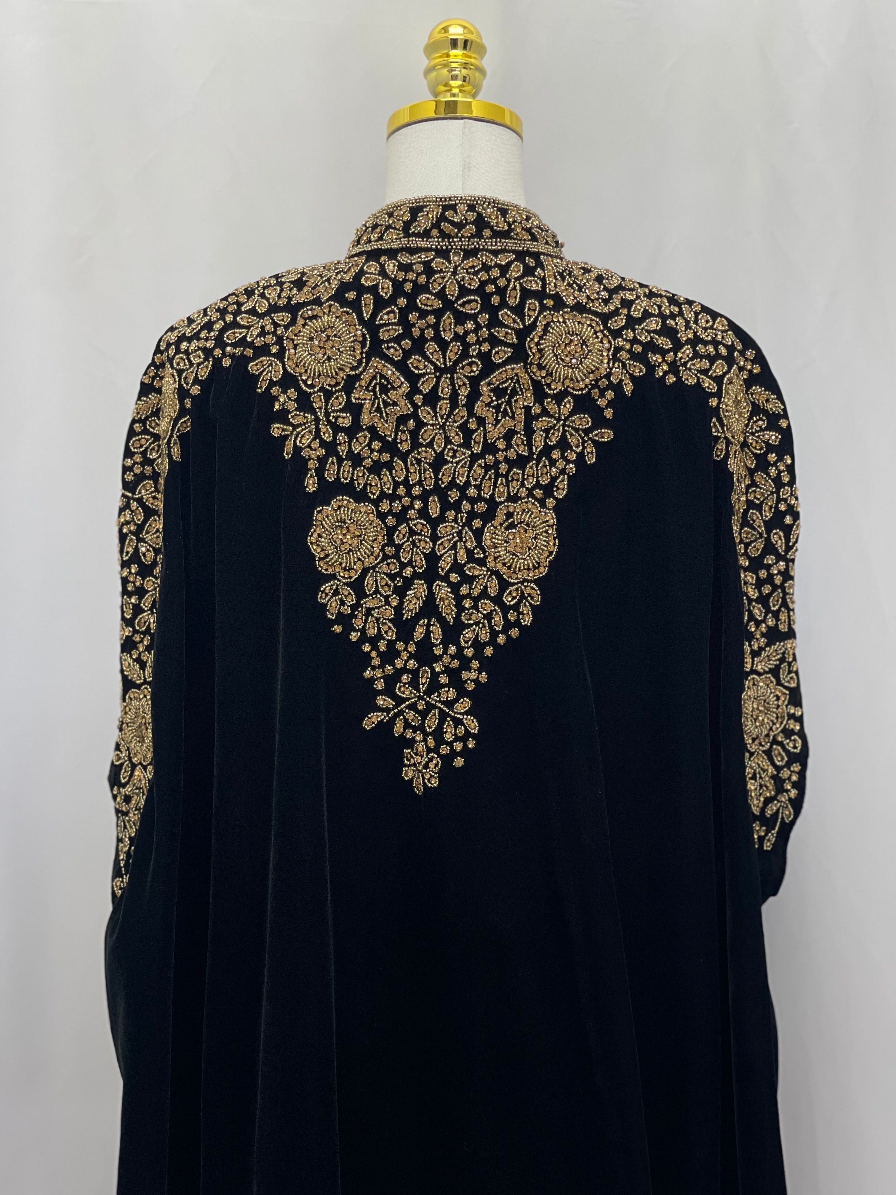 Palestinian Elegance Velvet Embellished Cape black cardigan with intricate gold floral embroidery on back and sleeves
