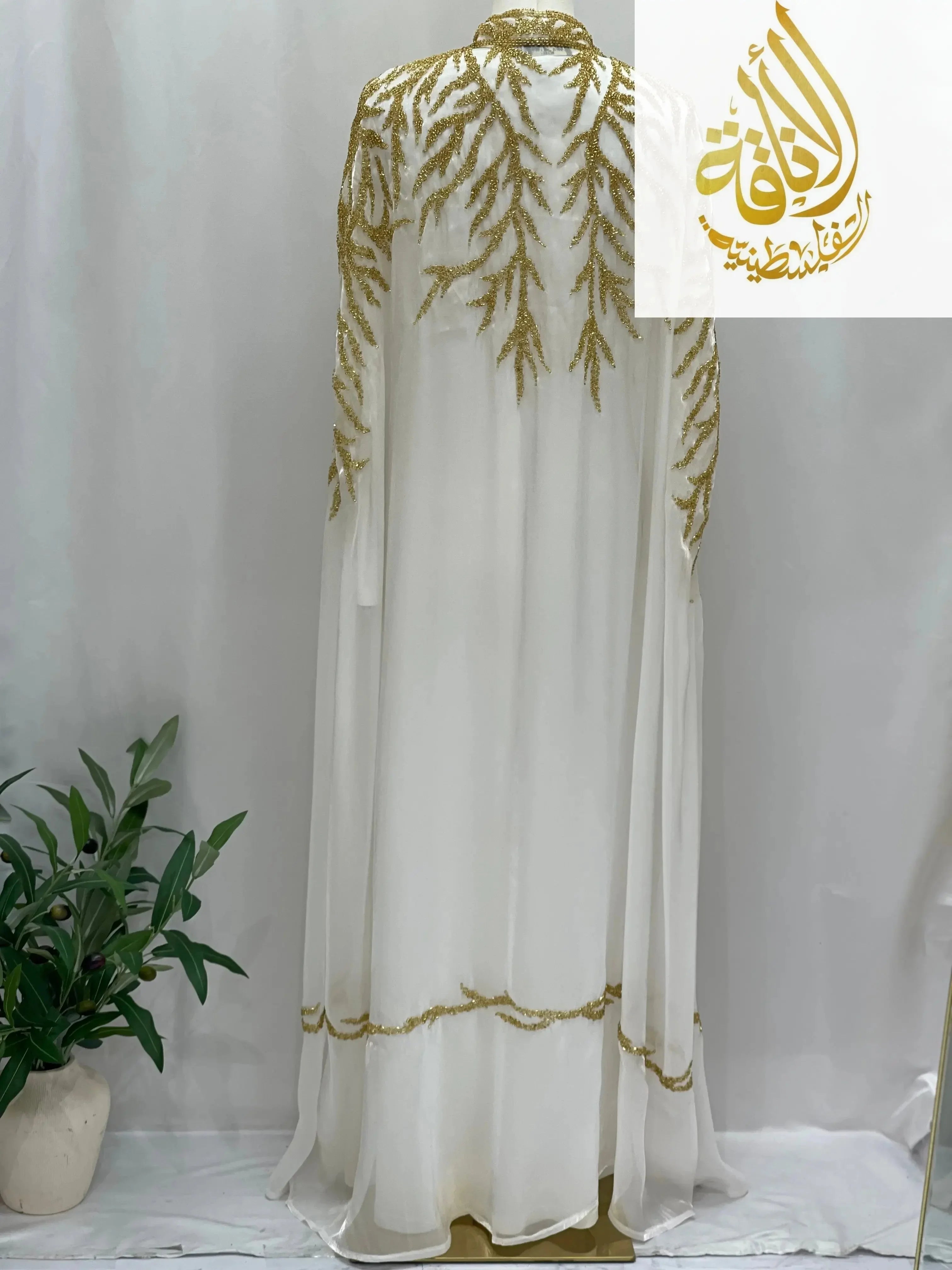 Palestinian Elegance Luxury Majestic Embellished Cape white cardigan with gold embroidery detailing