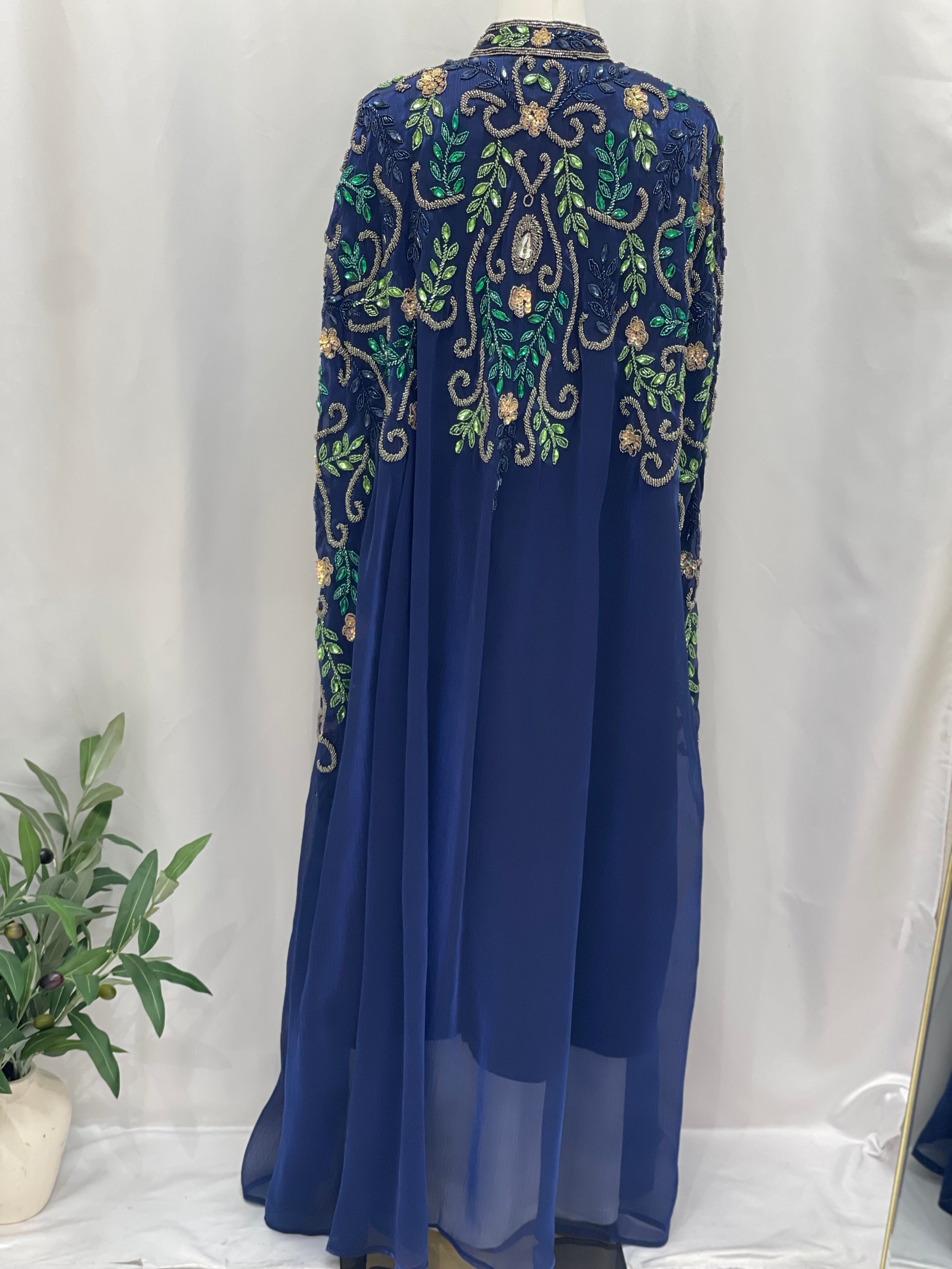 Palestinian Elegance Royal Blue Bejeweled Cape cardigan with intricate gold and green embroidery on the upper back and sleeves