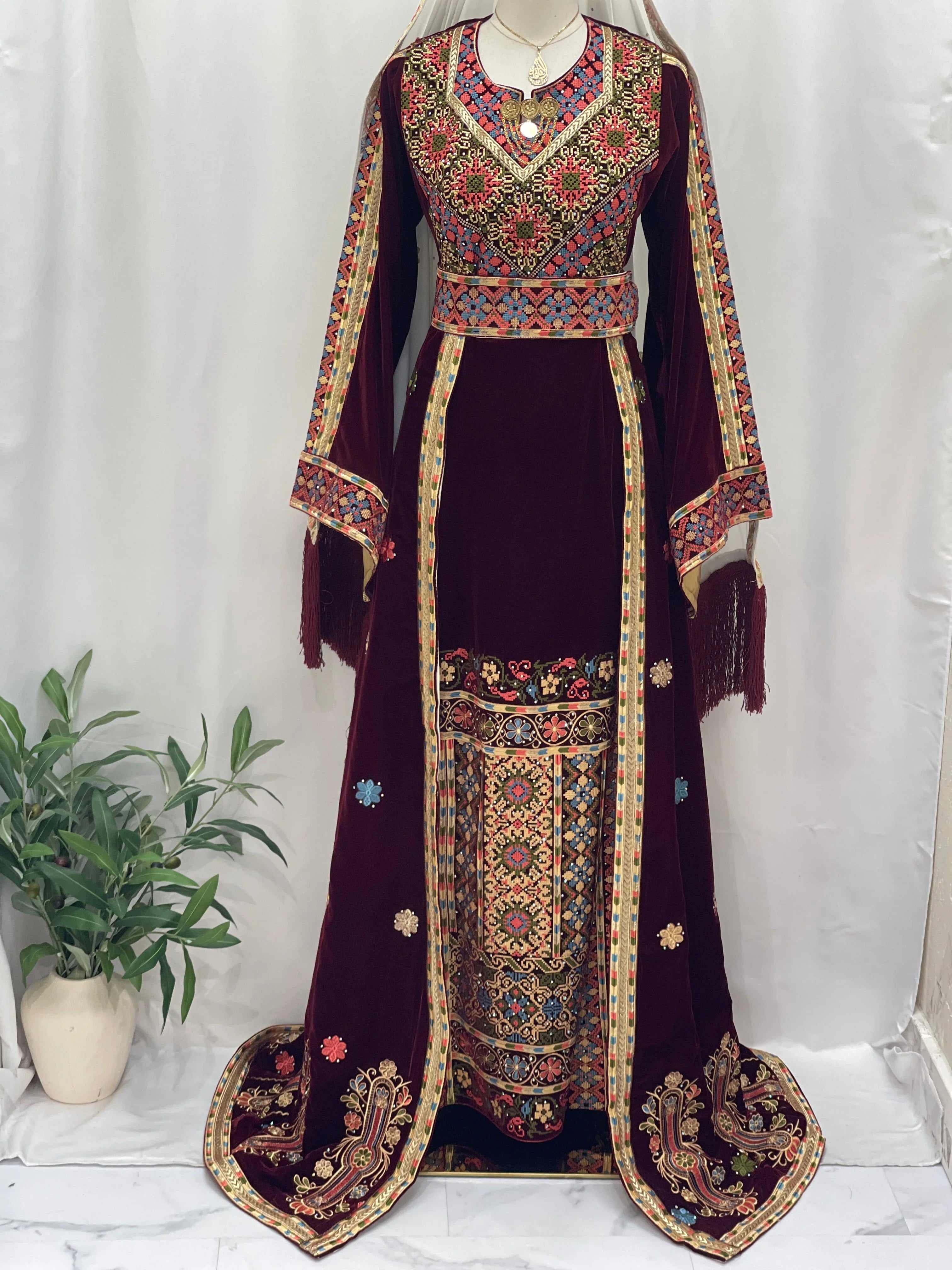 Maise Velevt Embroidered Thoub in rich red with intricate designs and elegant fringed sleeves