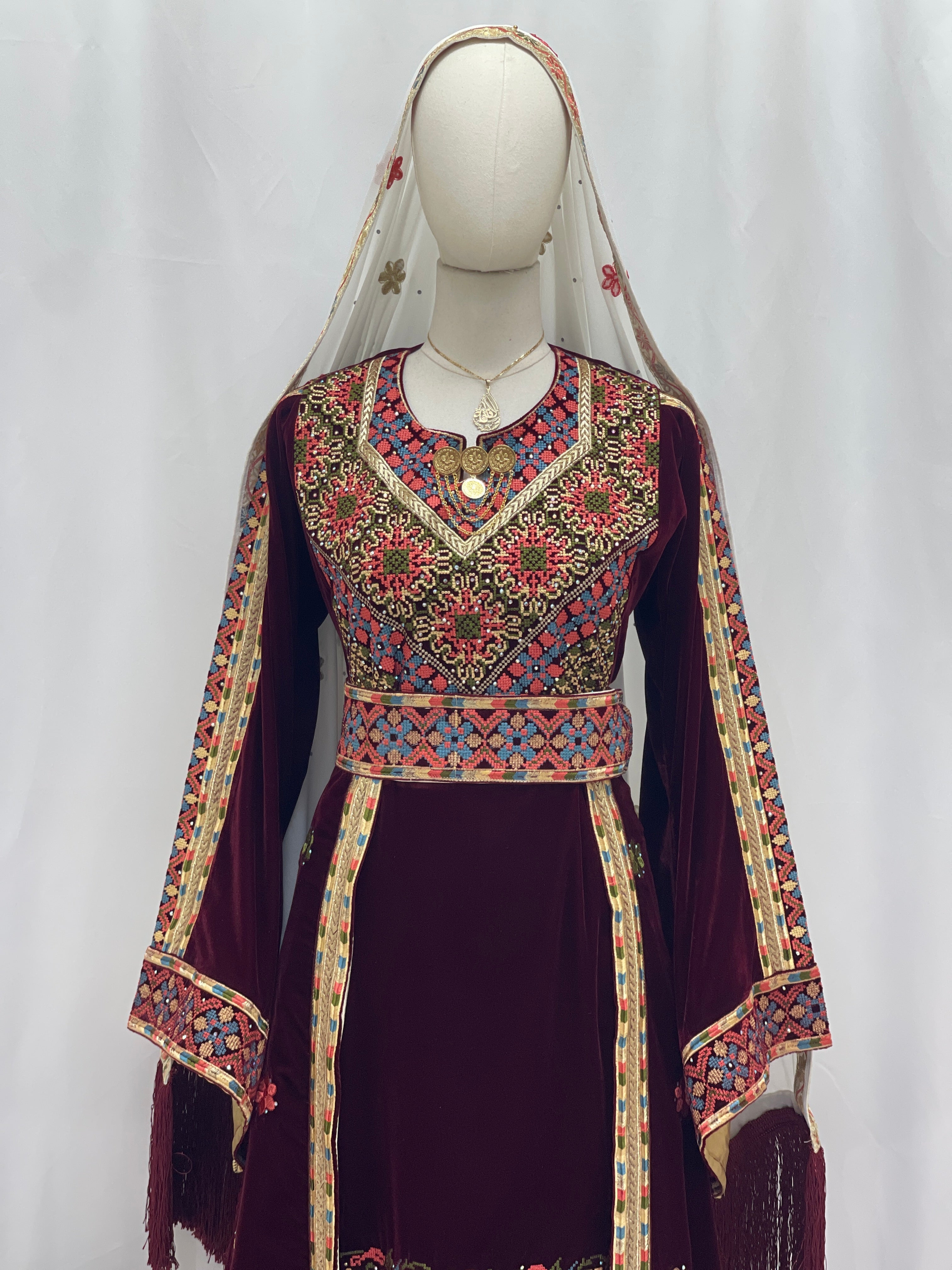 Maise Velevt Embroidered Thoub in burgundy with floral designs and traditional patterns for elegant occasions