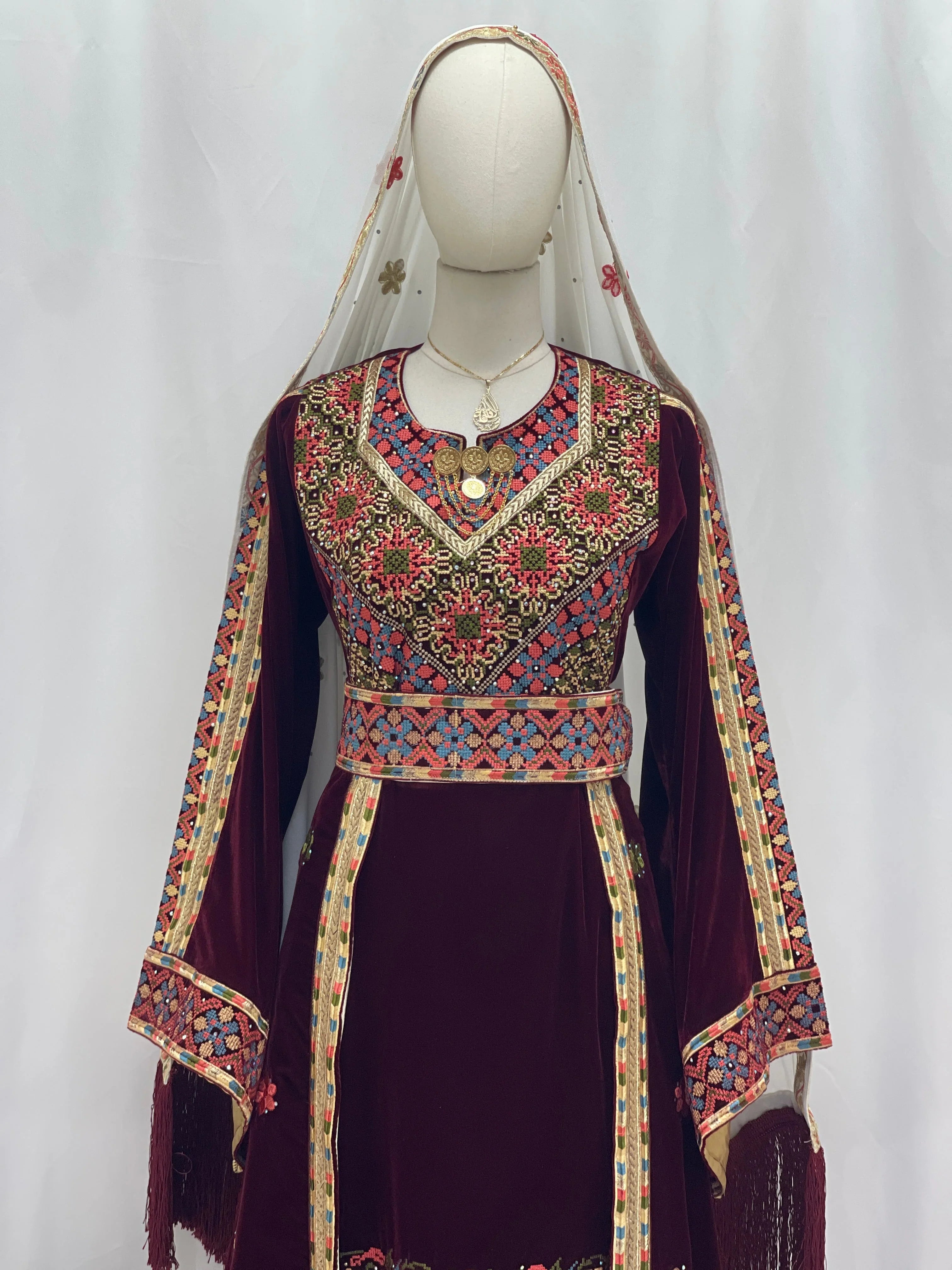 Maise Velevt Embroidered Thoub in burgundy with floral designs and traditional patterns for elegant occasions