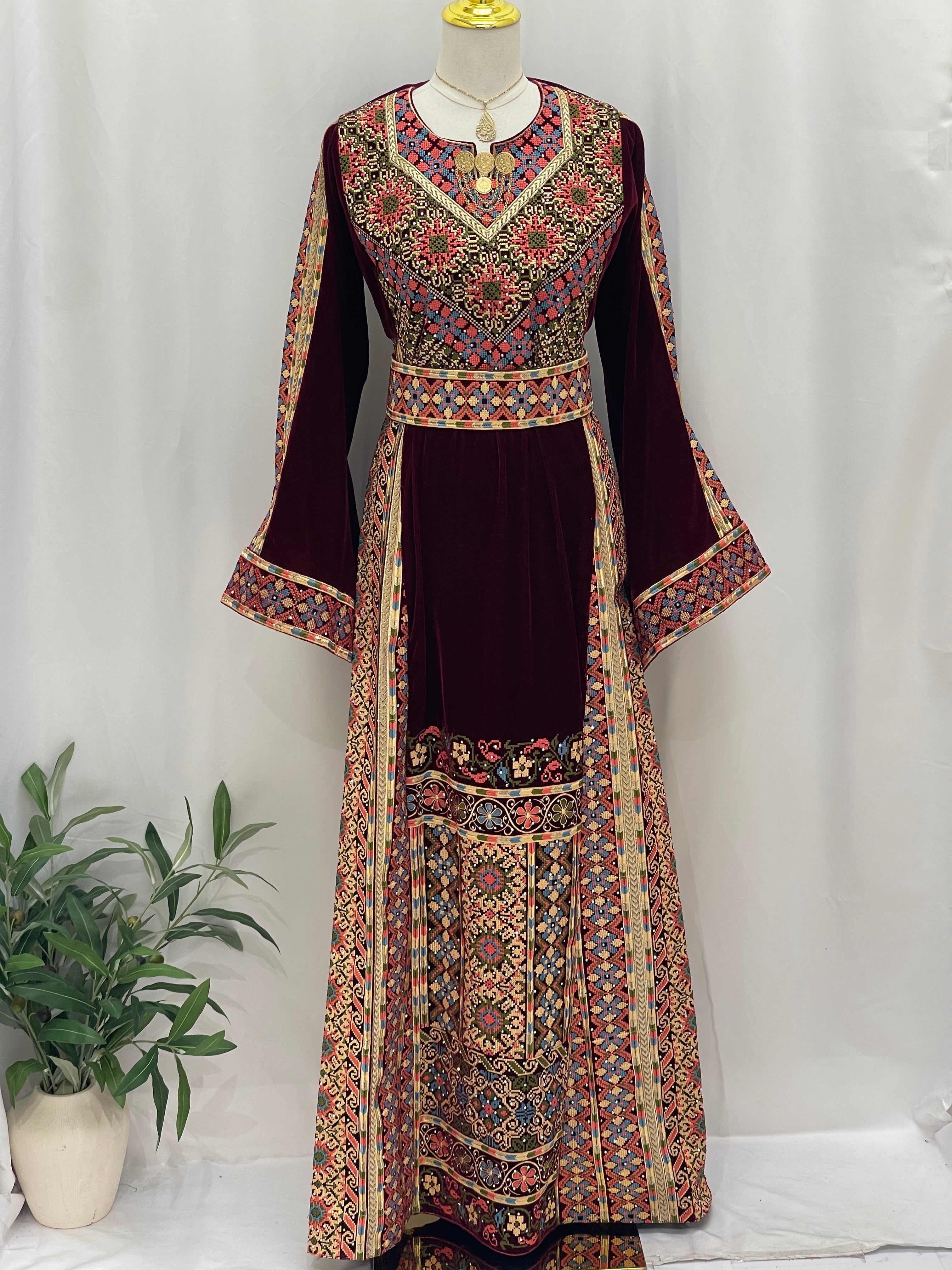 Maise Velevt Embroidered Thoub in rich burgundy with intricate patterns and bell sleeves