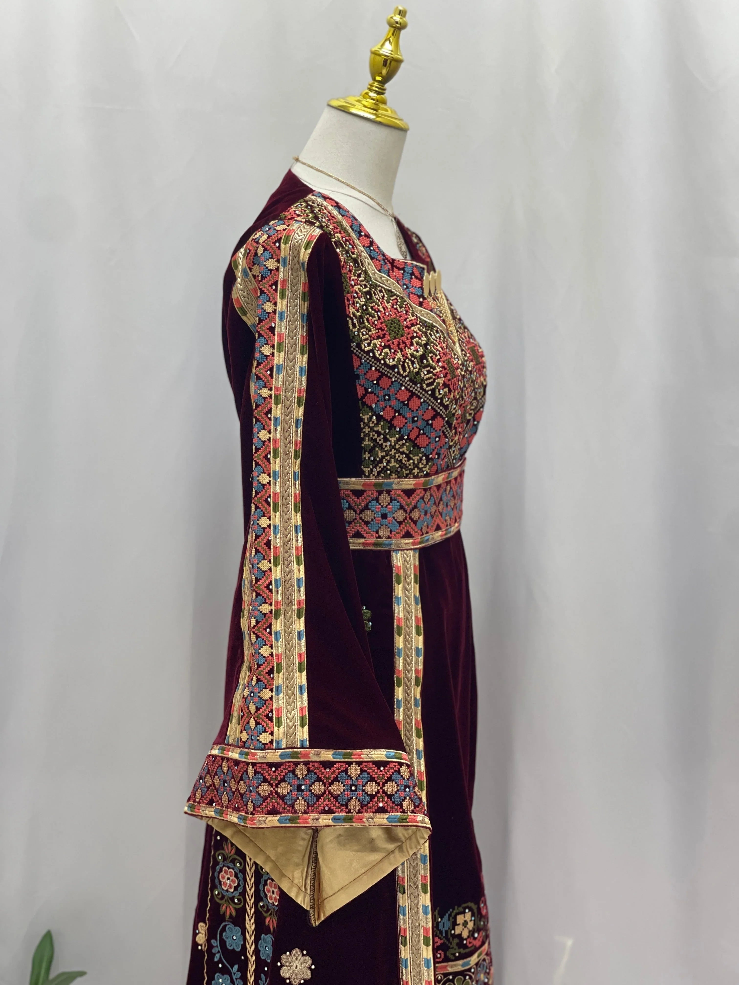 Maise Velevt Embroidered Thoub in burgundy with intricate floral designs and elegant bell sleeves