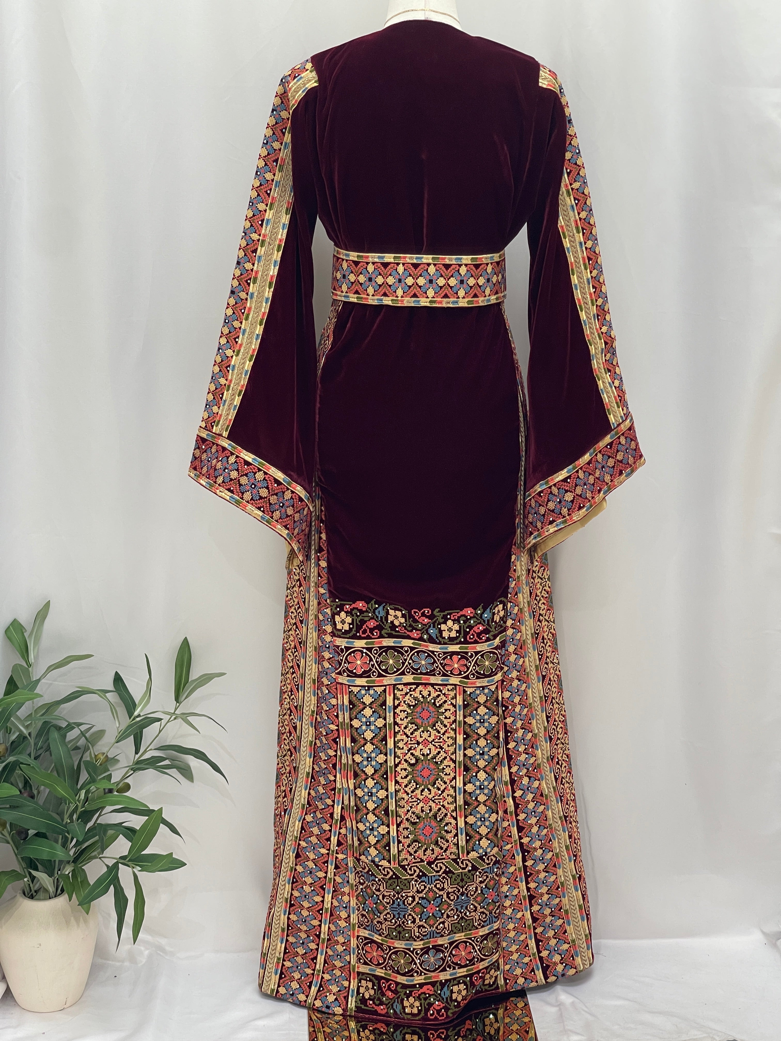 Maise Velvet Embroidered Thoub with intricate floral patterns and flowing sleeves, perfect for elegant occasions.