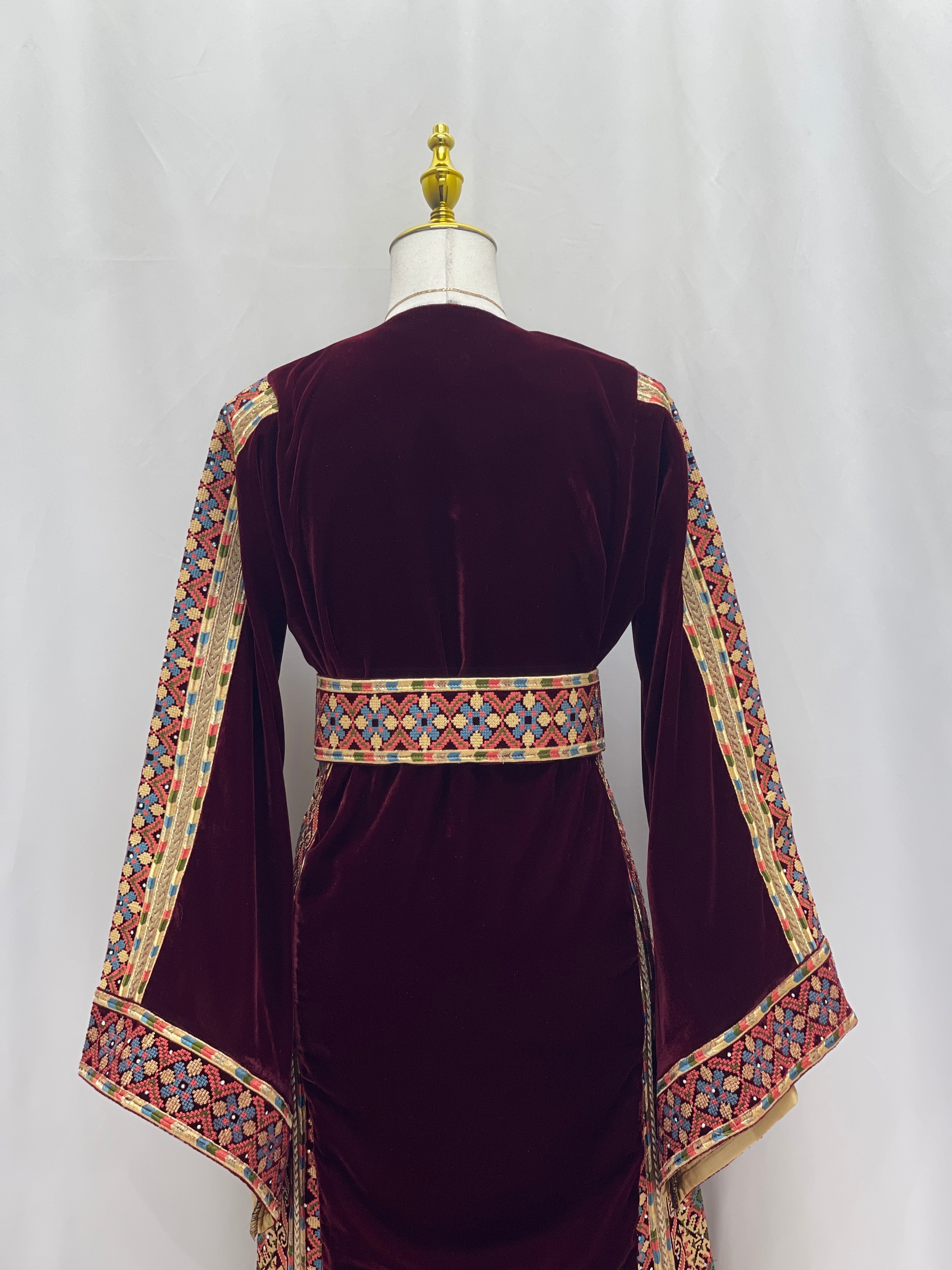 Back view of Maise Velevt Embroidered Thoub in deep burgundy with colorful detailed embroidery