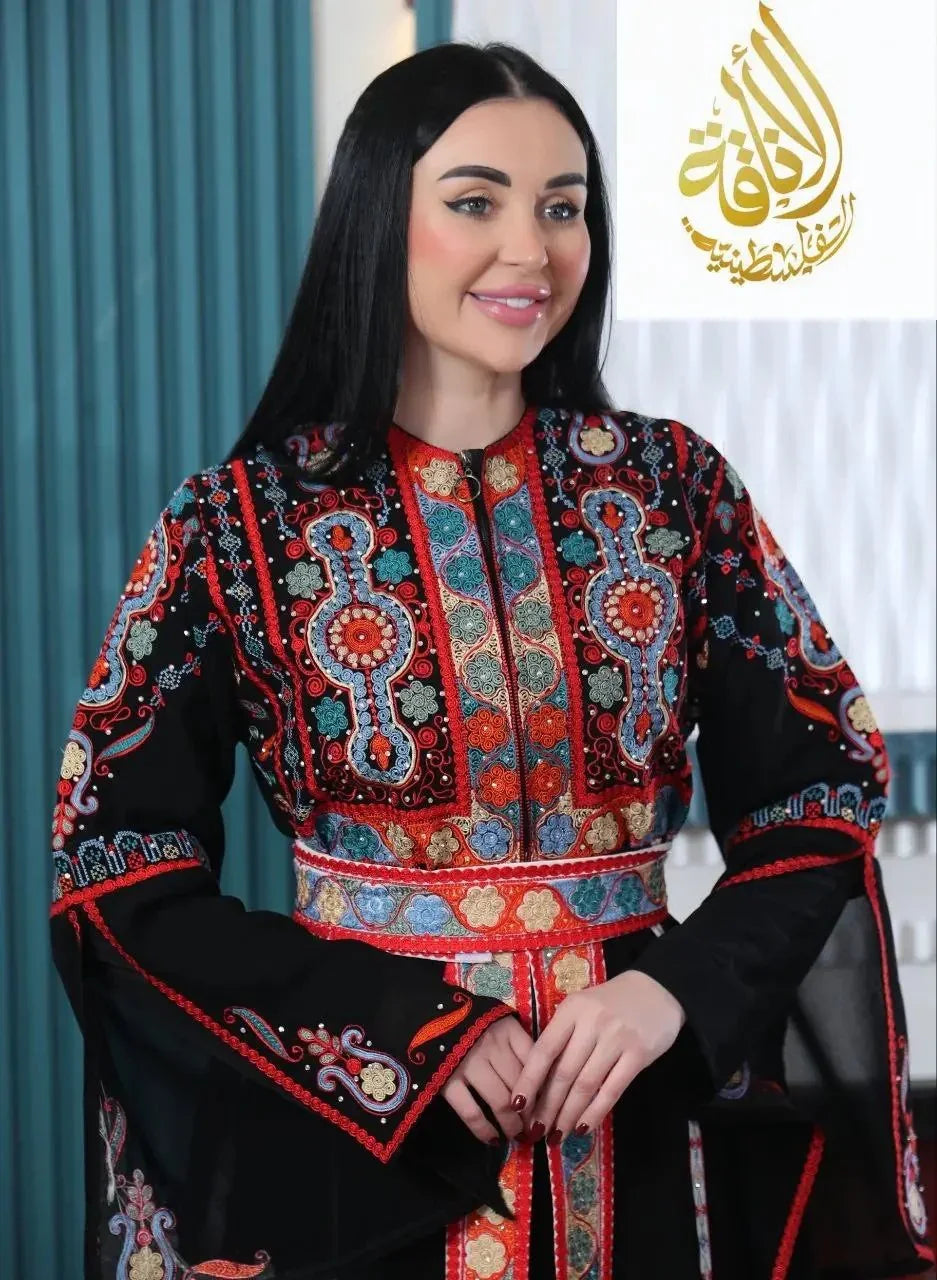 Palestinian Elegance Malaki embroidered kaftan with intricate colorful embroidery on black fabric worn by woman