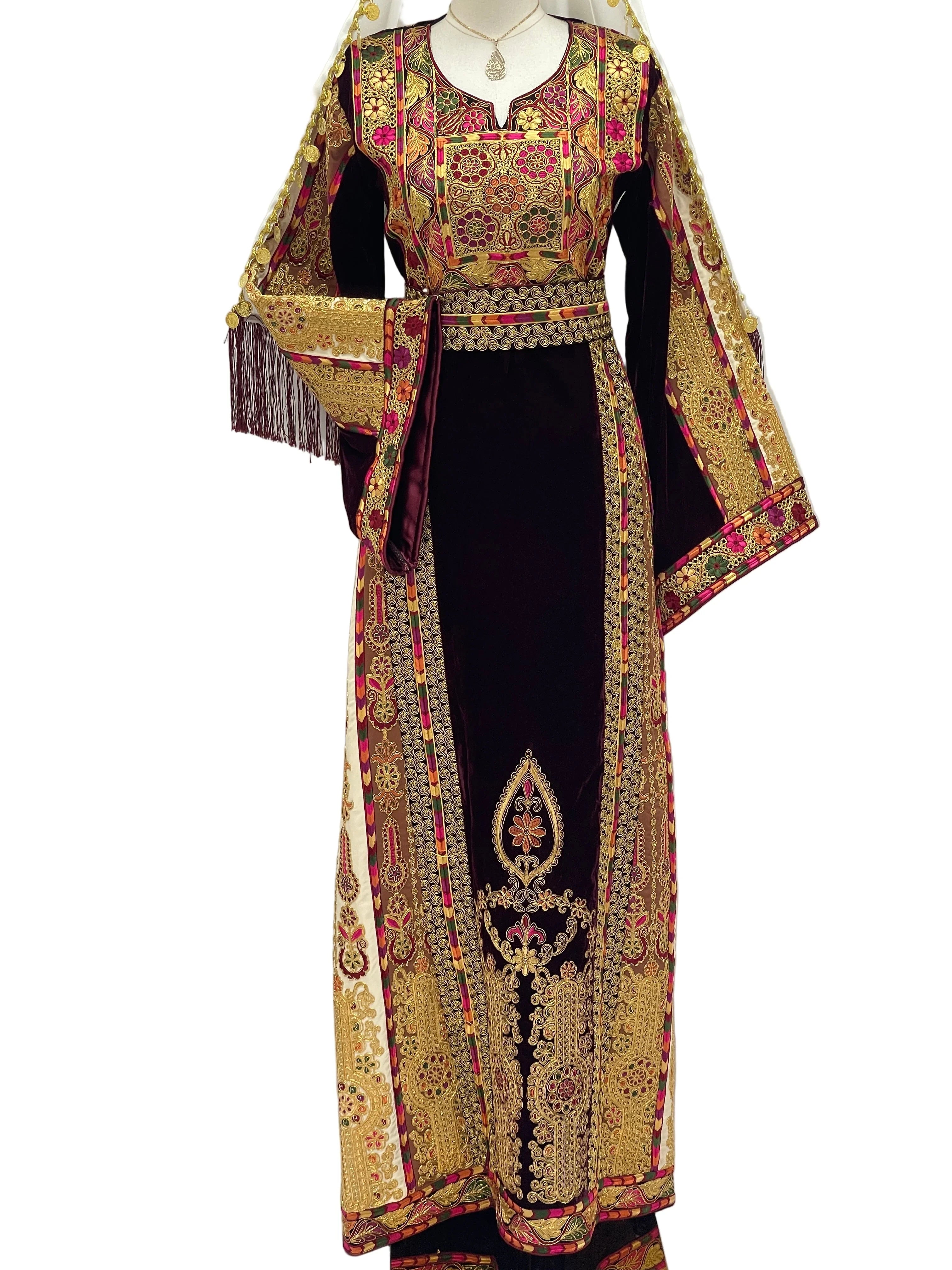 Elegant Malikat al-Turath Thoub with intricate gold embroidery and traditional Palestinian design