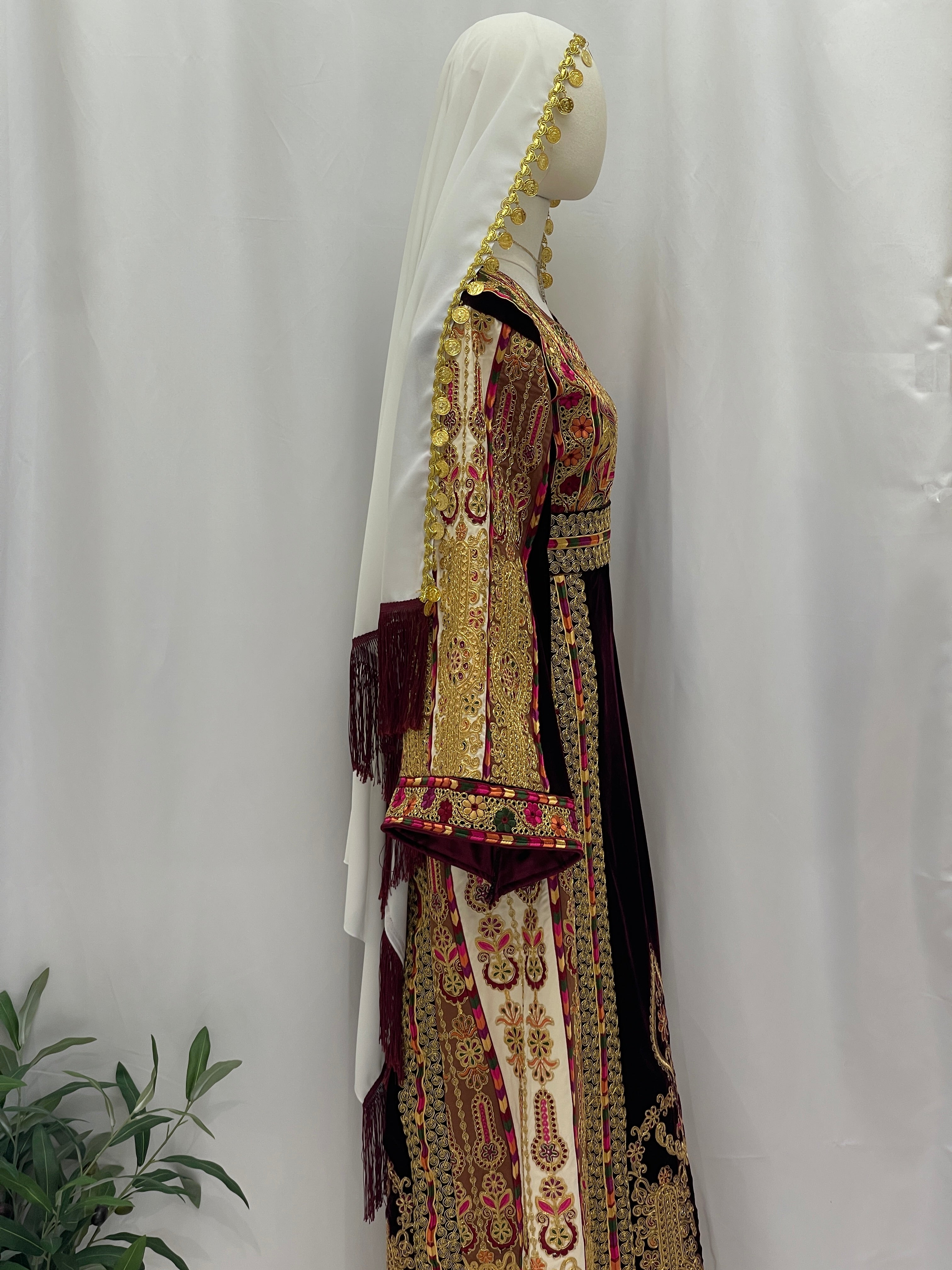 Side view of Malikat al-Turath Thoub with intricate embroidery and elegant design by Palestinian Elegance