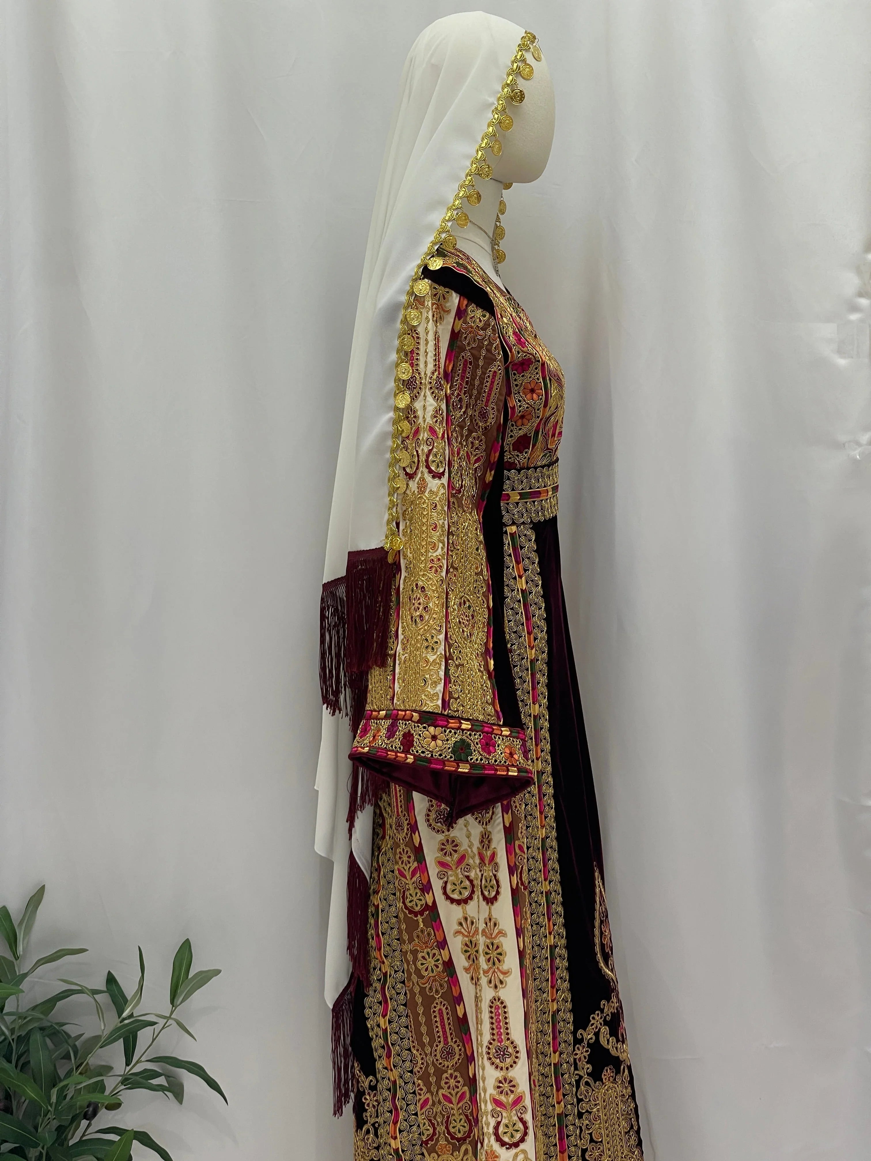 Side view of Malikat al-Turath Thoub with intricate embroidery and elegant design by Palestinian Elegance