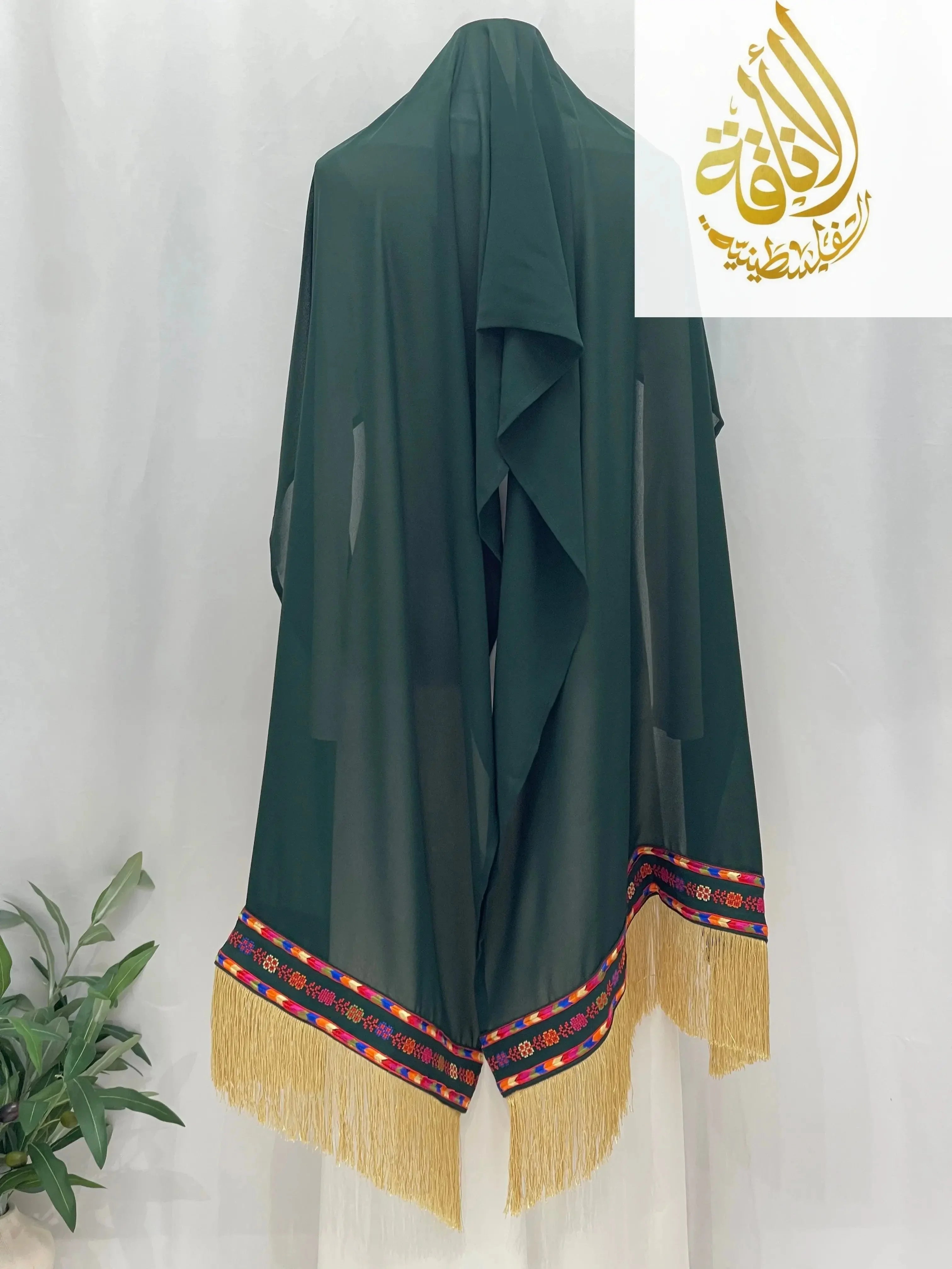 Green Manjal Khirka-Shal hijab with colorful embroidered border and golden fringe by Palestinian Elegance
