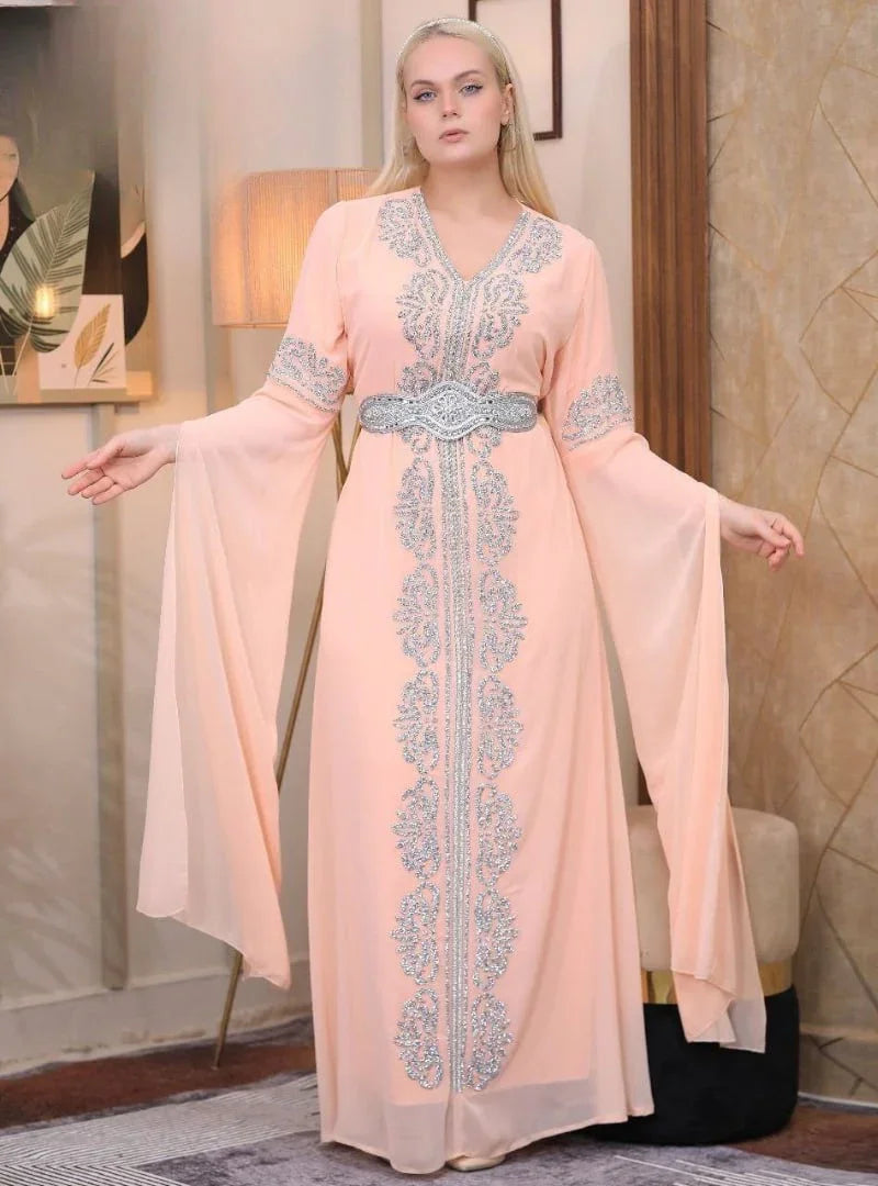 Palestinian Elegance embroidered kaftan dress in soft peach with intricate silver embroidery and flowing sleeves