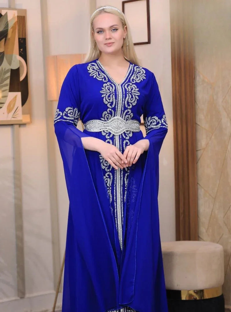 Palestinian Elegance blue embroidered kaftan dress with silver detailing and long flowing sleeves