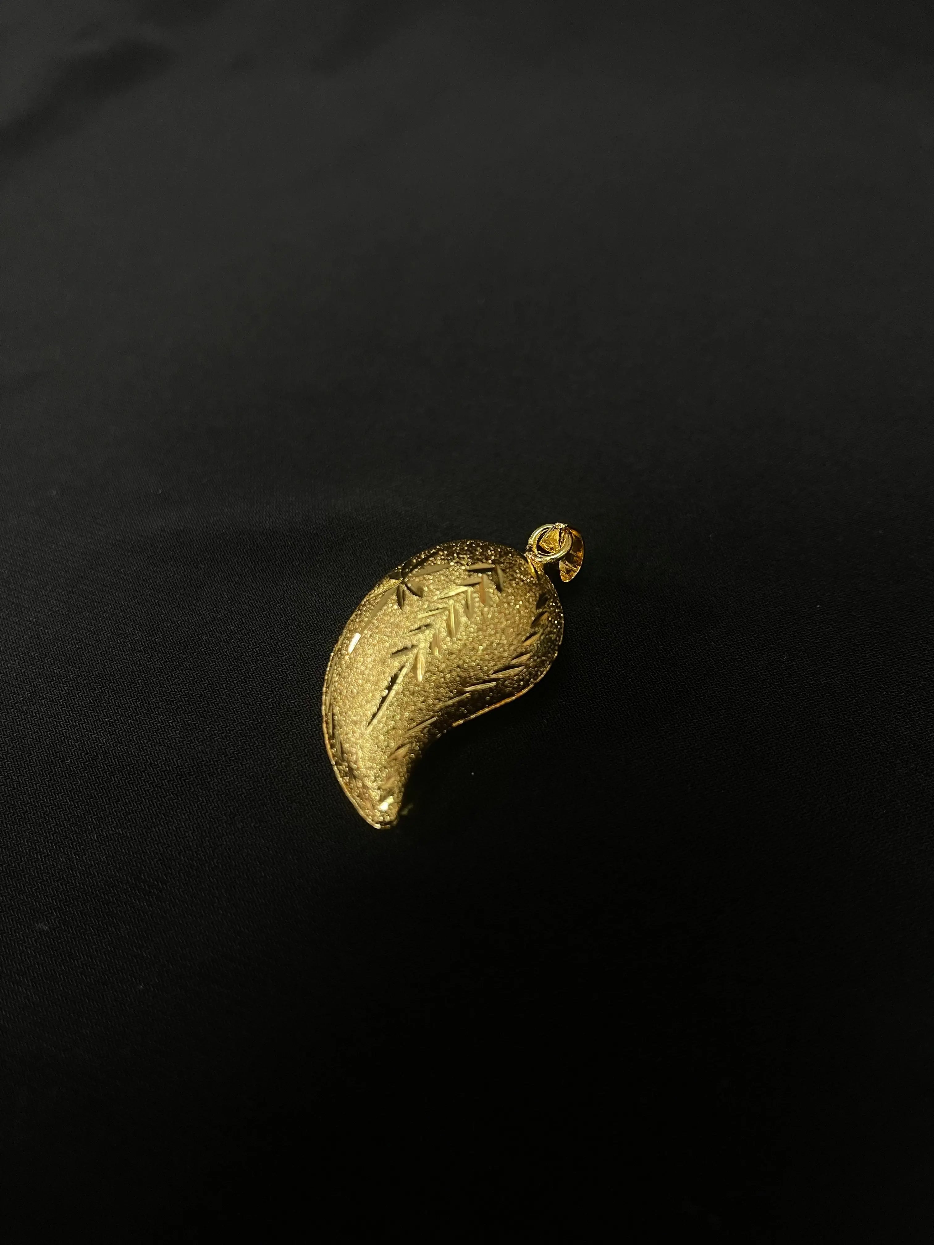 Medium Almond Pendant imitated gold jewelry piece by Palestinian Elegance with intricate leaf design