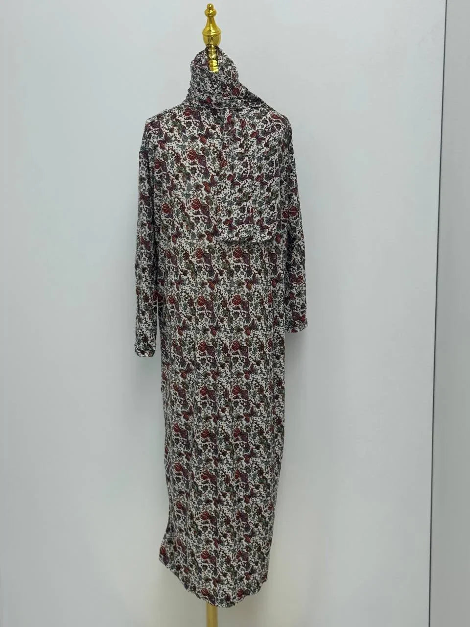 Palestinian Elegance floral patterned Full Prayer Dress on mannequin long sleeves high neckline